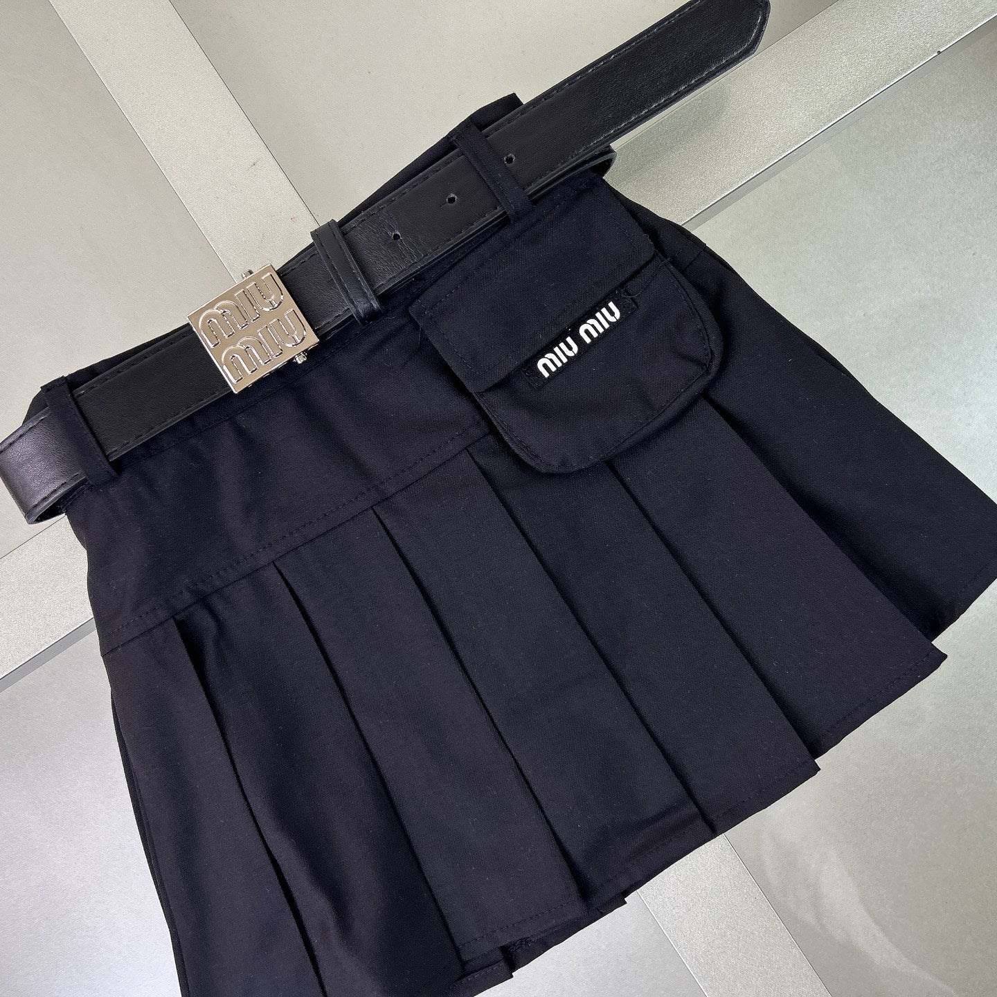 Navy-style shirt + pleated skirt