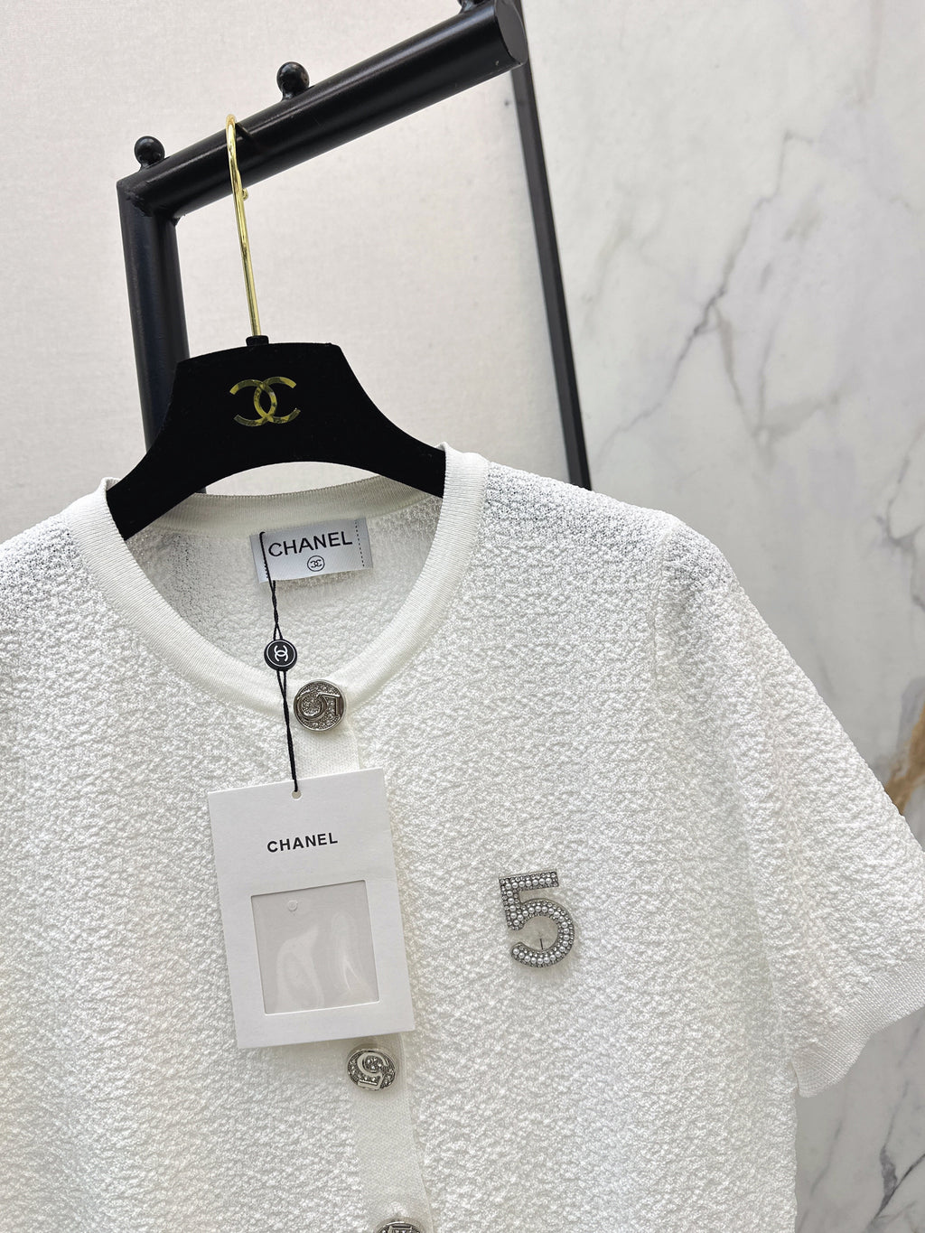 Hardware-embellished short-sleeved knit top