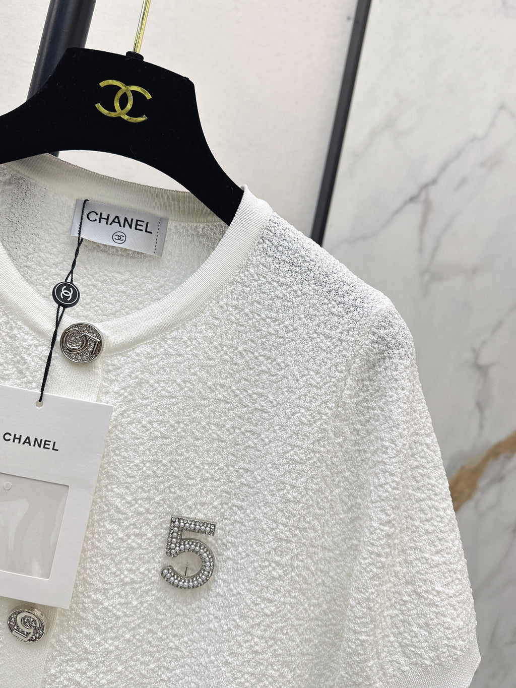 Hardware-embellished short-sleeved knit top