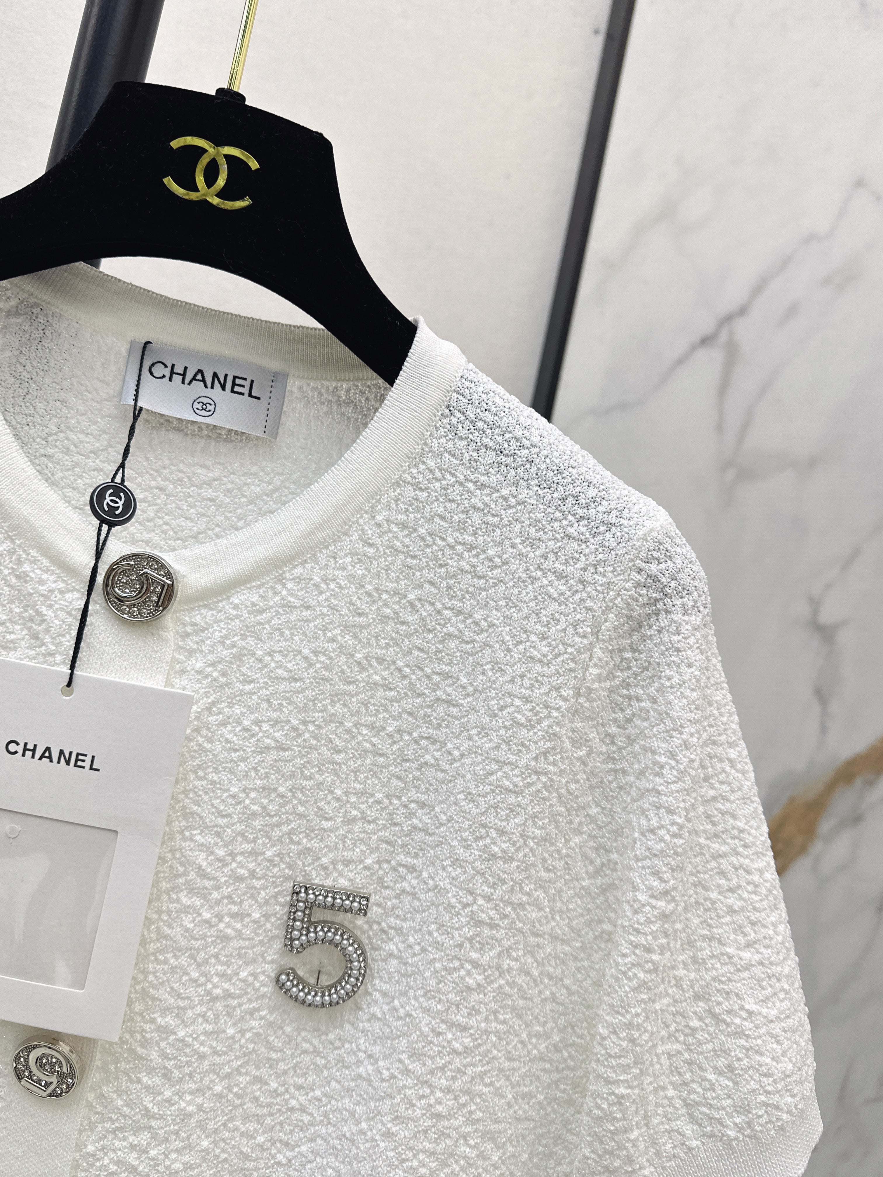 Hardware-embellished short-sleeved knit top