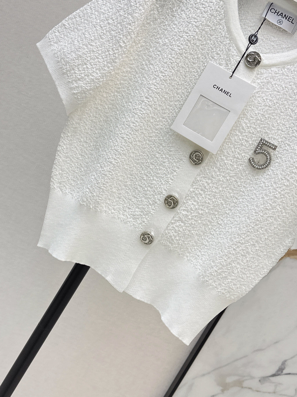 Hardware-embellished short-sleeved knit top