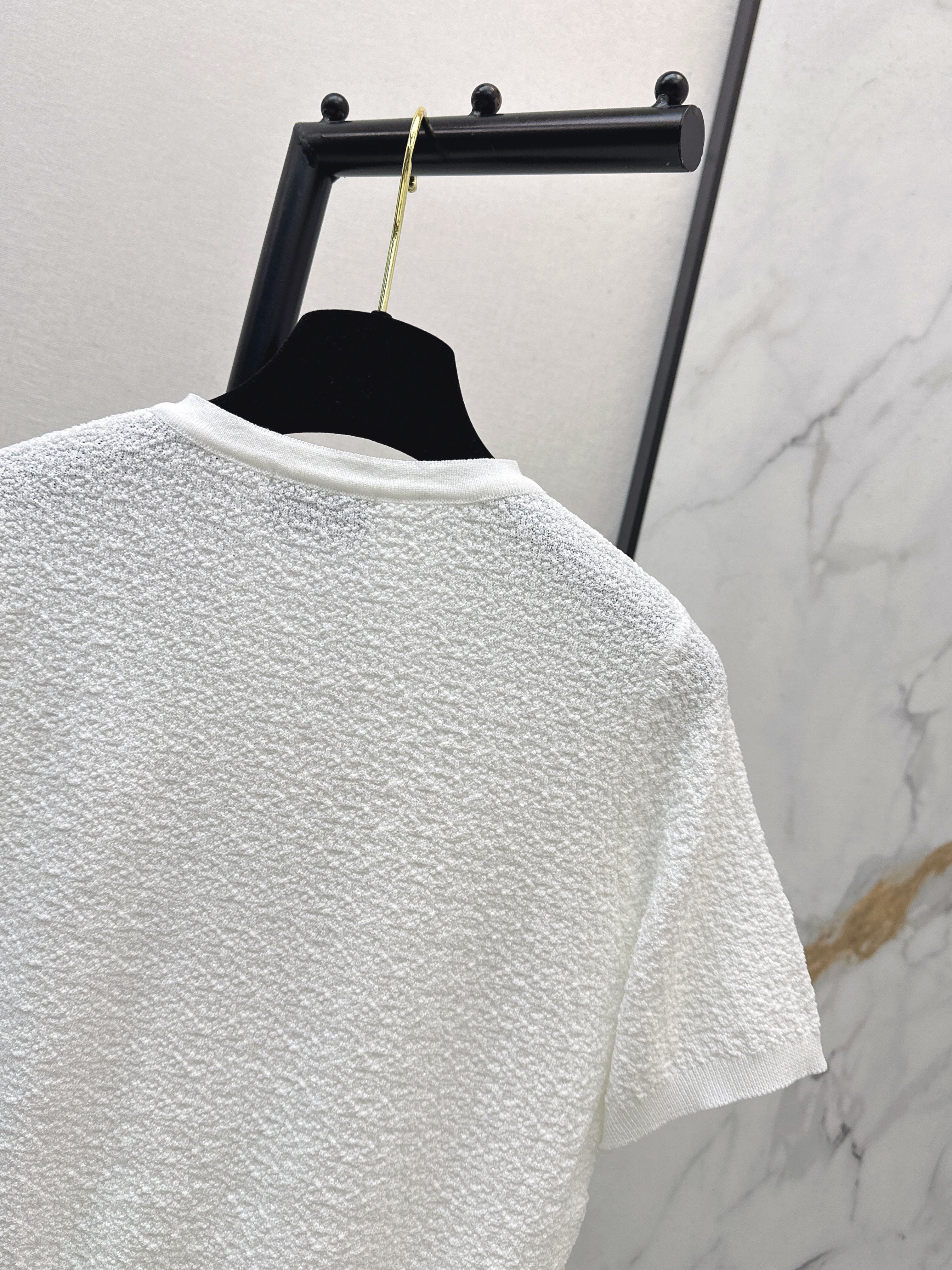 Hardware-embellished short-sleeved knit top