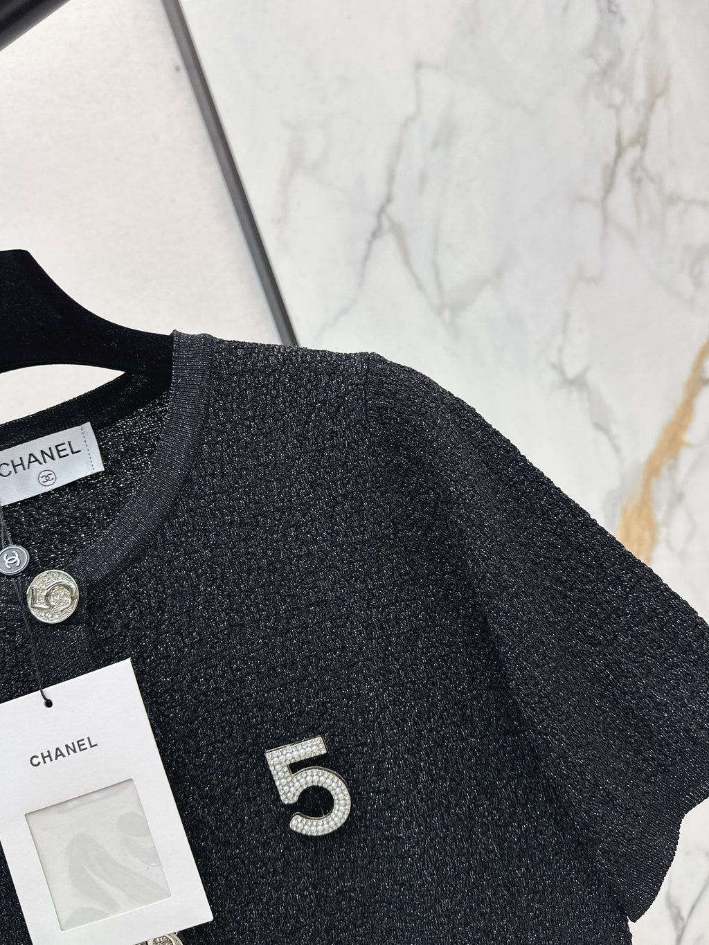 Hardware-embellished short-sleeved knit top