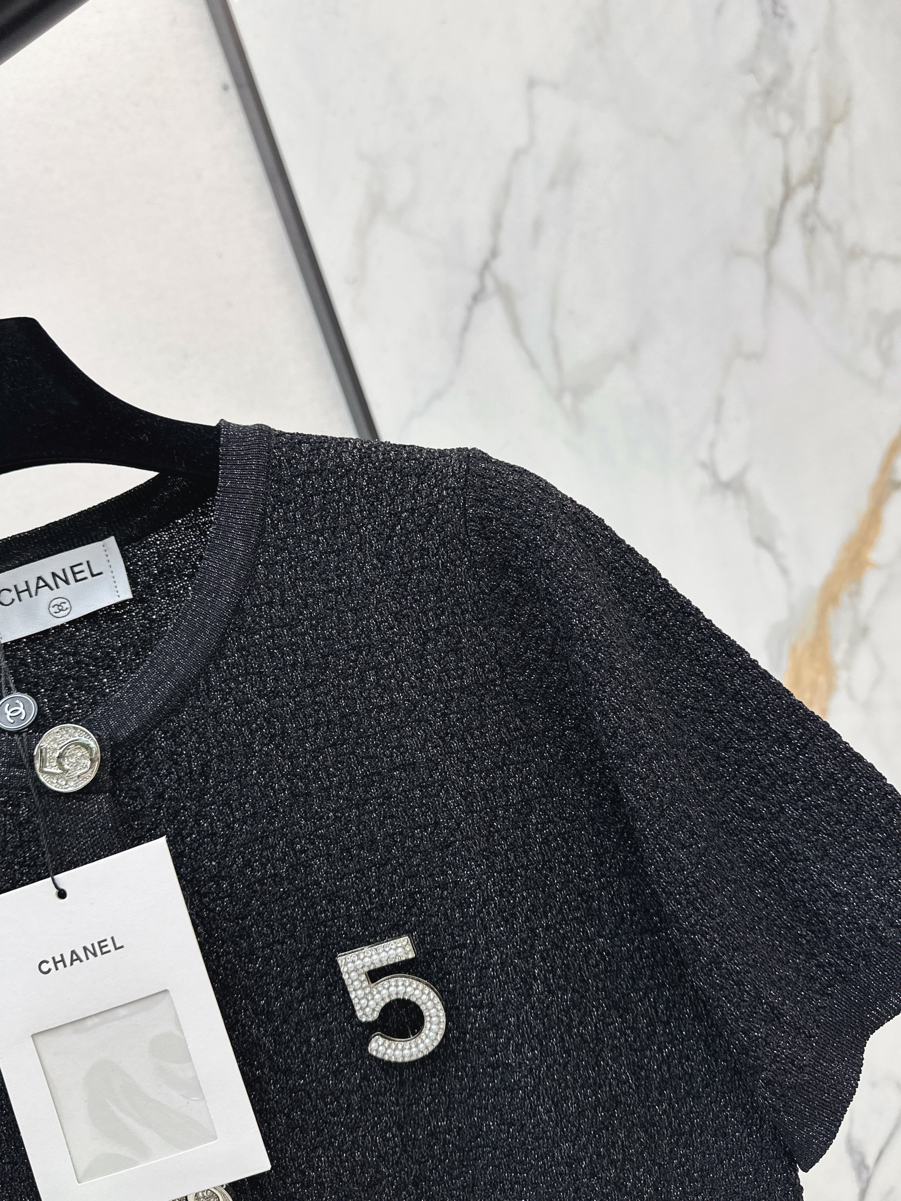 Hardware-embellished short-sleeved knit top