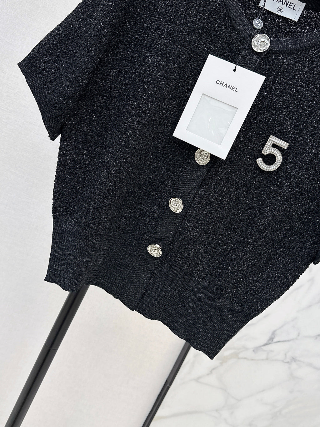 Hardware-embellished short-sleeved knit top