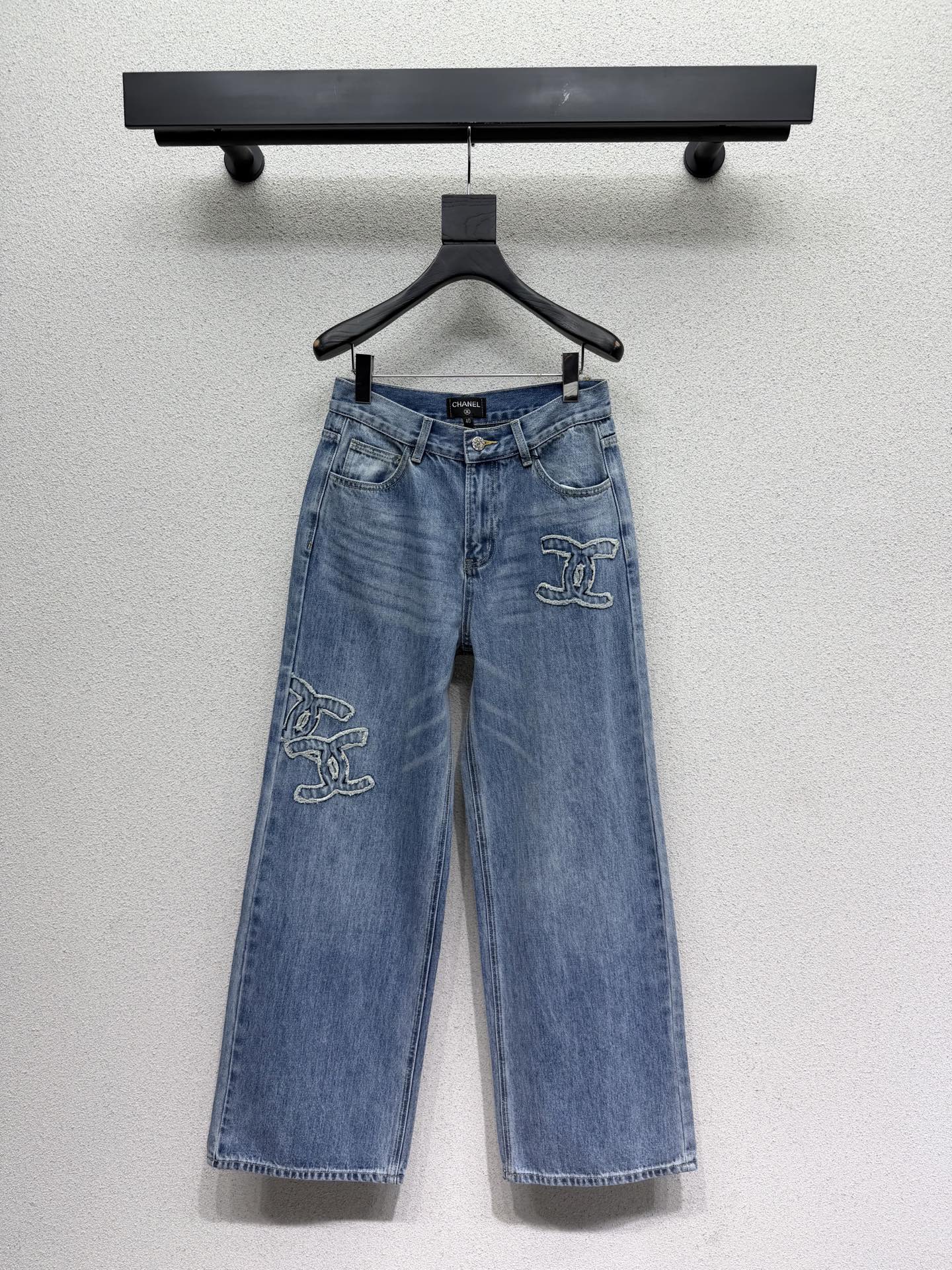 Embroidered logo patch jeans