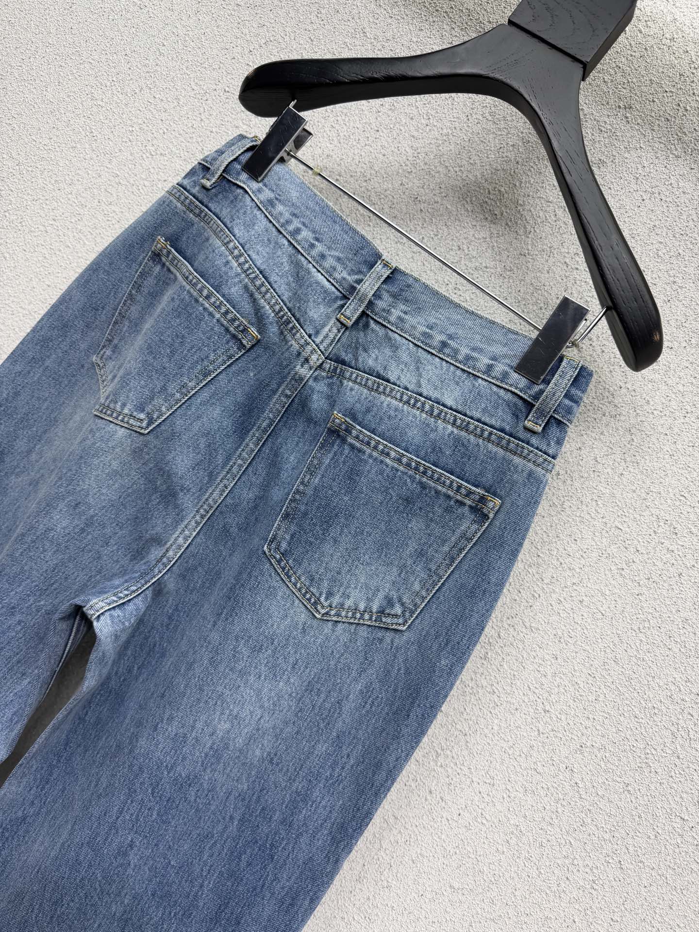 Embroidered logo patch jeans