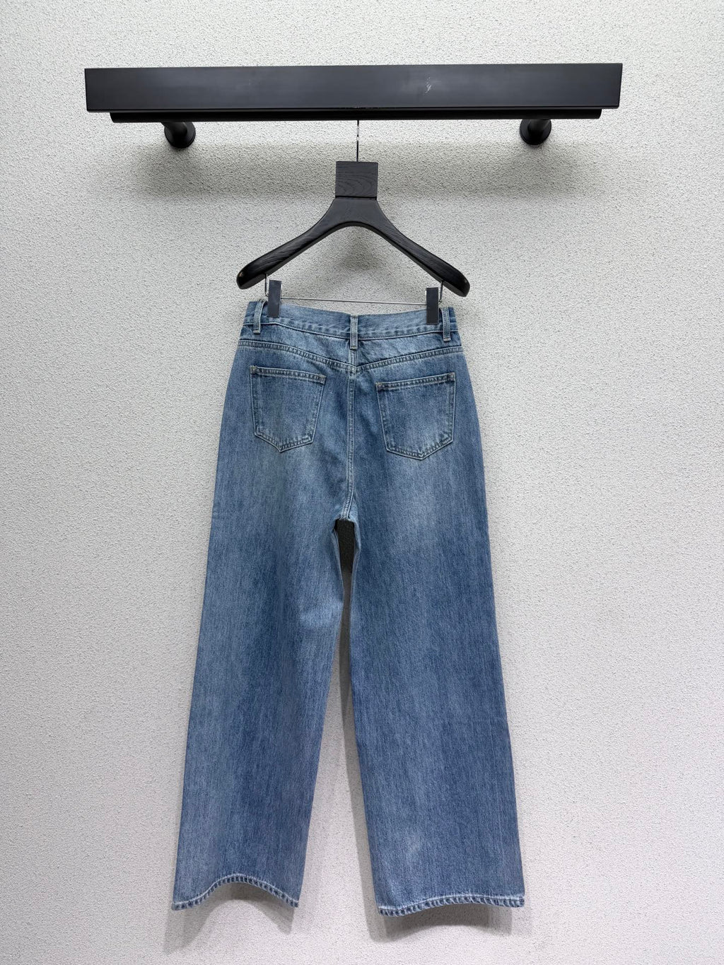 Embroidered logo patch jeans
