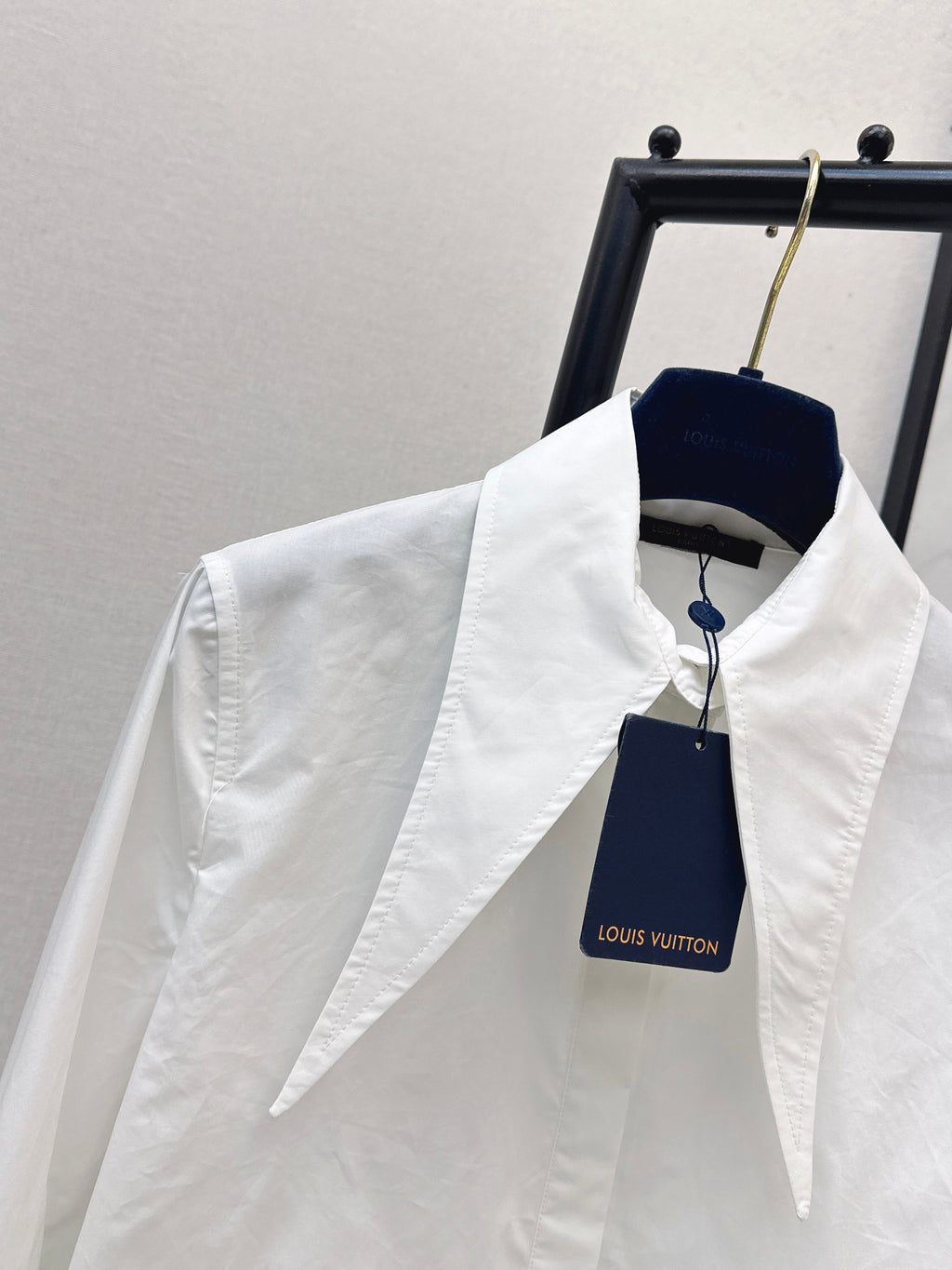 Minimalist white shirt with a long pointed collar