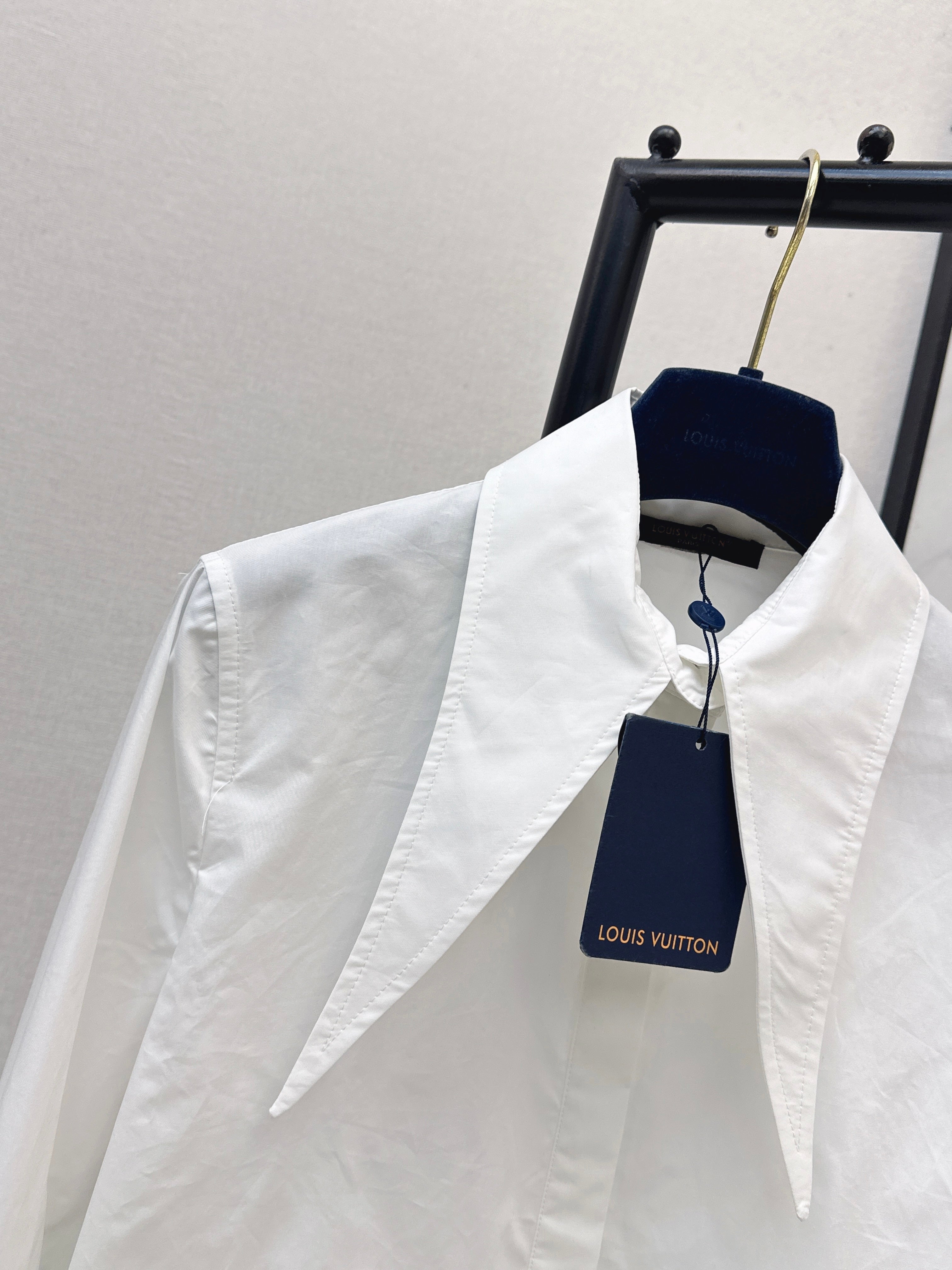 Minimalist white shirt with a long pointed collar