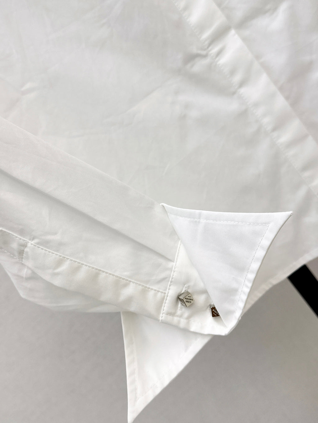 Minimalist white shirt with a long pointed collar