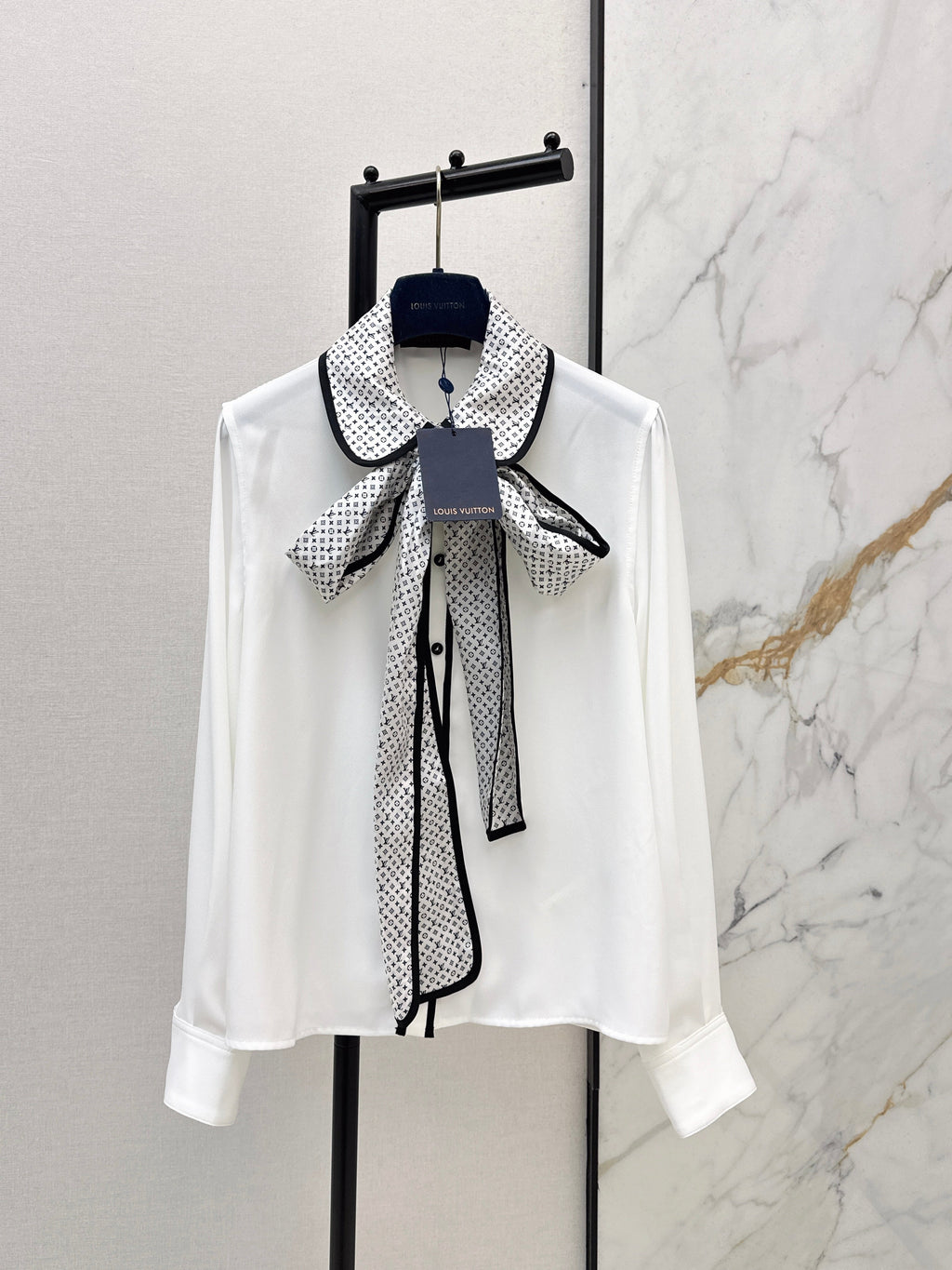 Minimalist white shirt with a long pointed collar