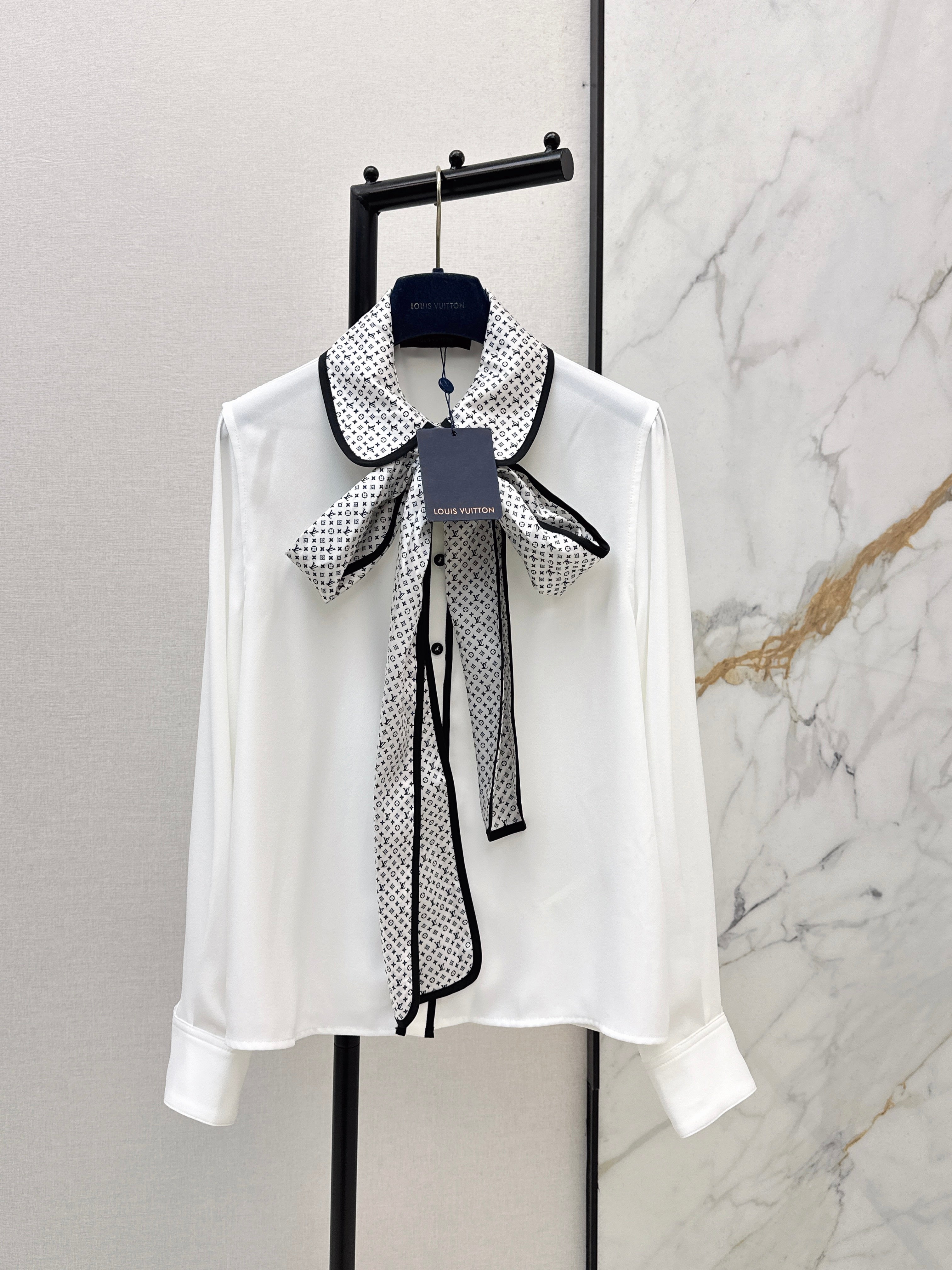 Minimalist white shirt with a long pointed collar
