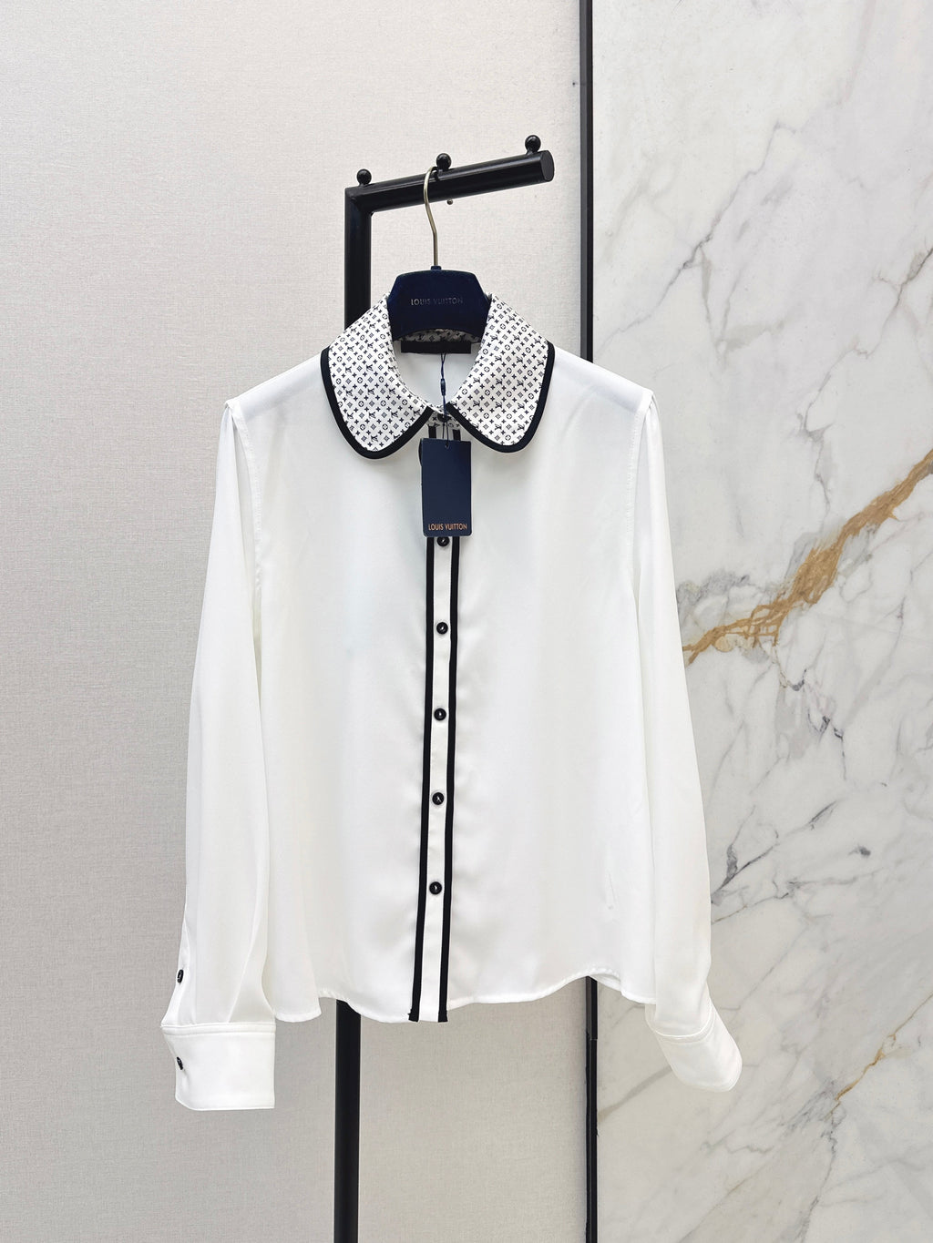 Minimalist white shirt with a long pointed collar
