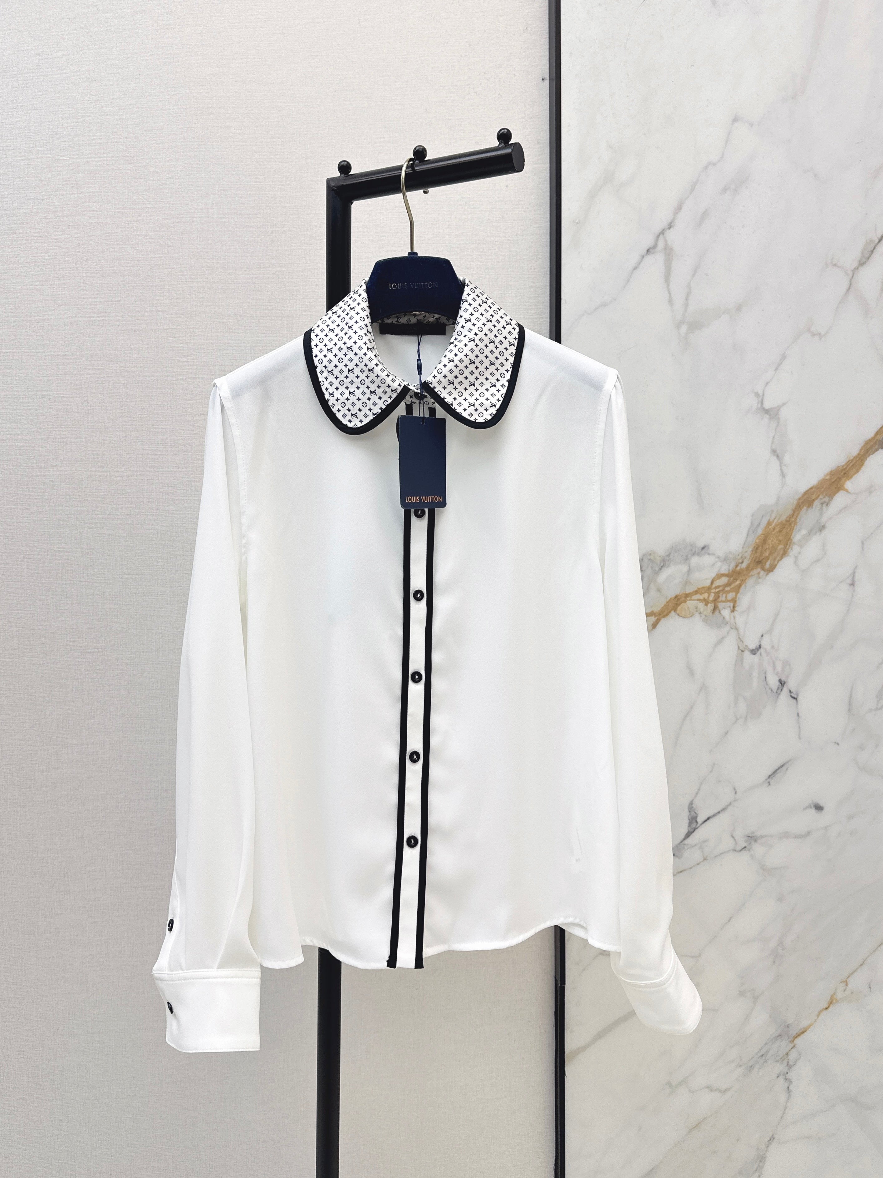 Minimalist white shirt with a long pointed collar