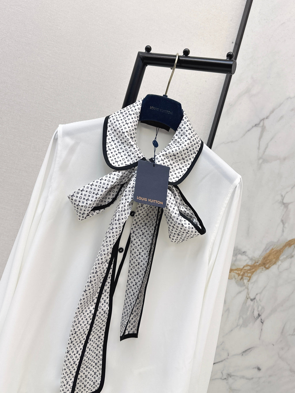 Minimalist white shirt with a long pointed collar
