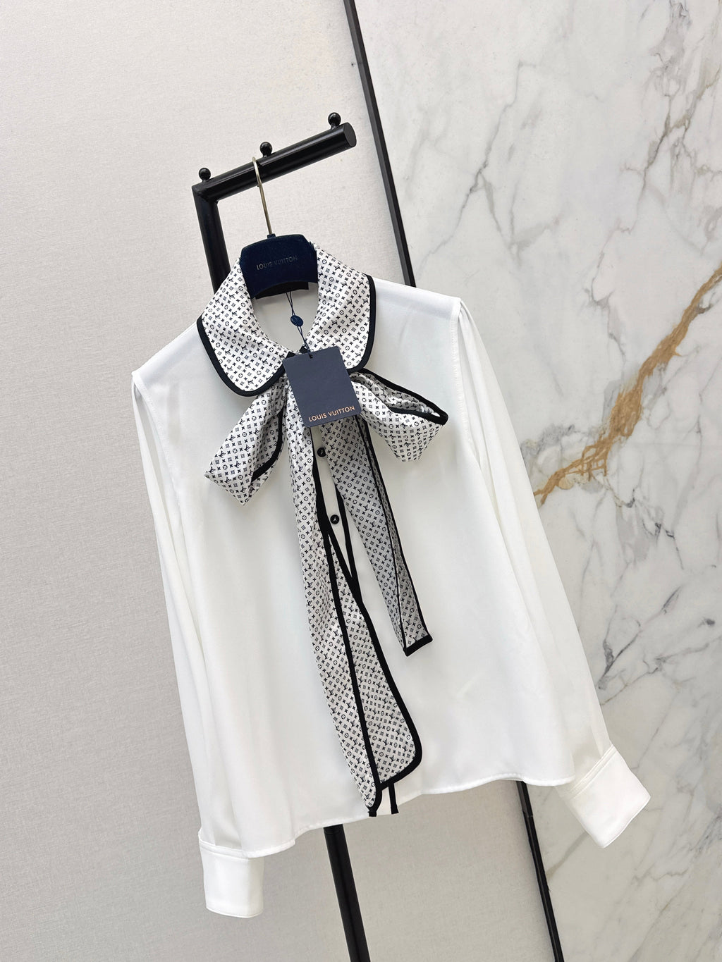 Minimalist white shirt with a long pointed collar