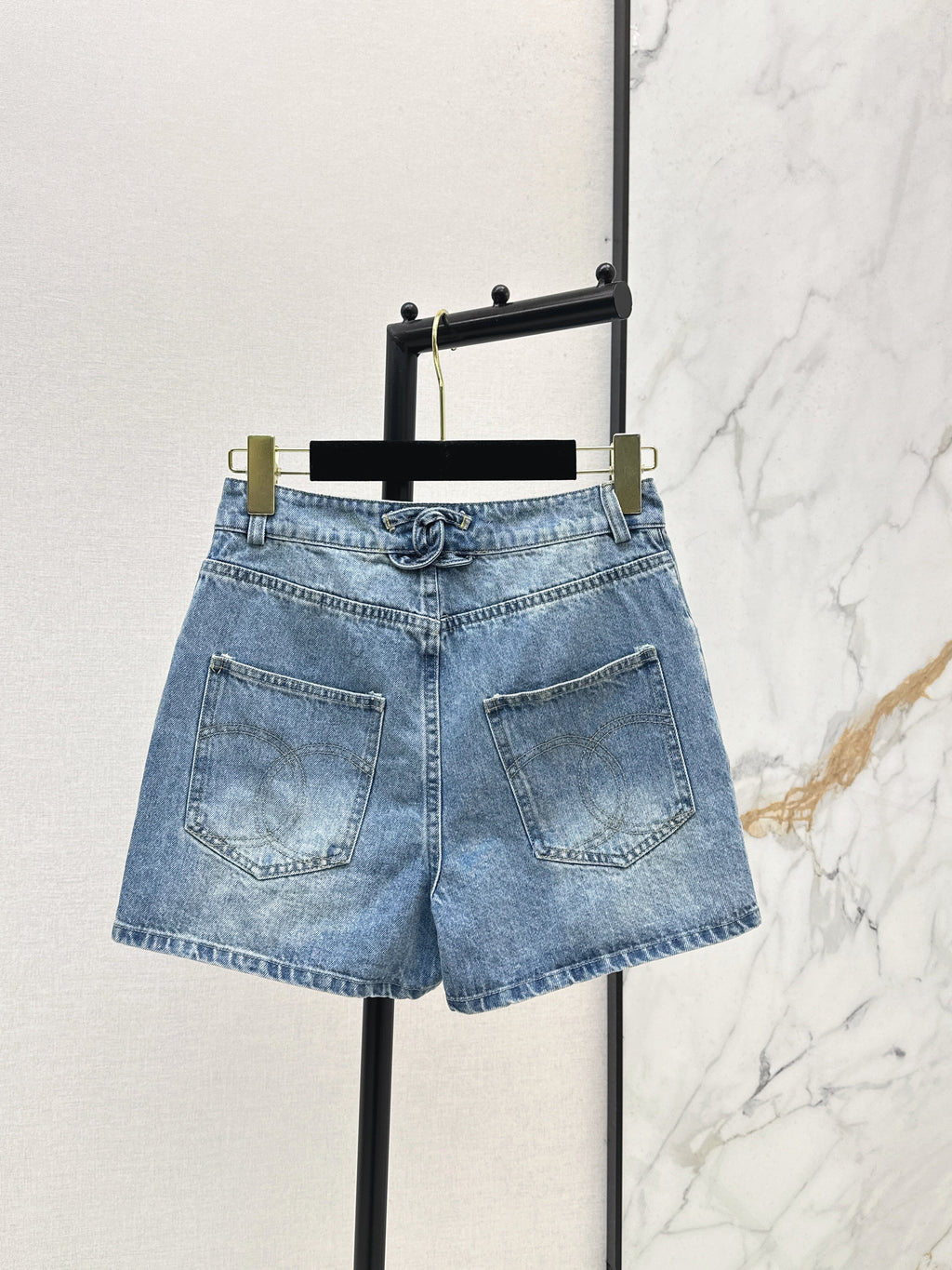 Denim shorts with back waist decoration
