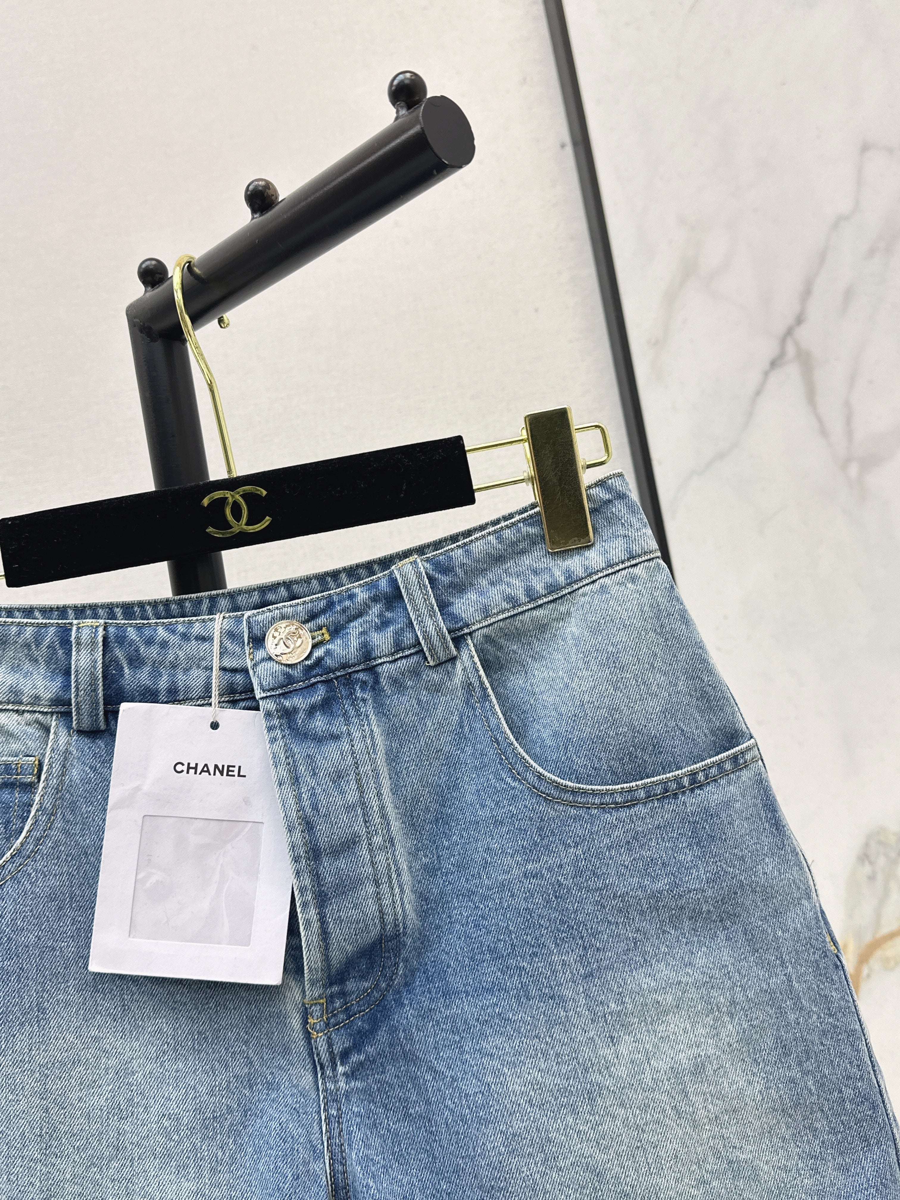 Denim shorts with back waist decoration