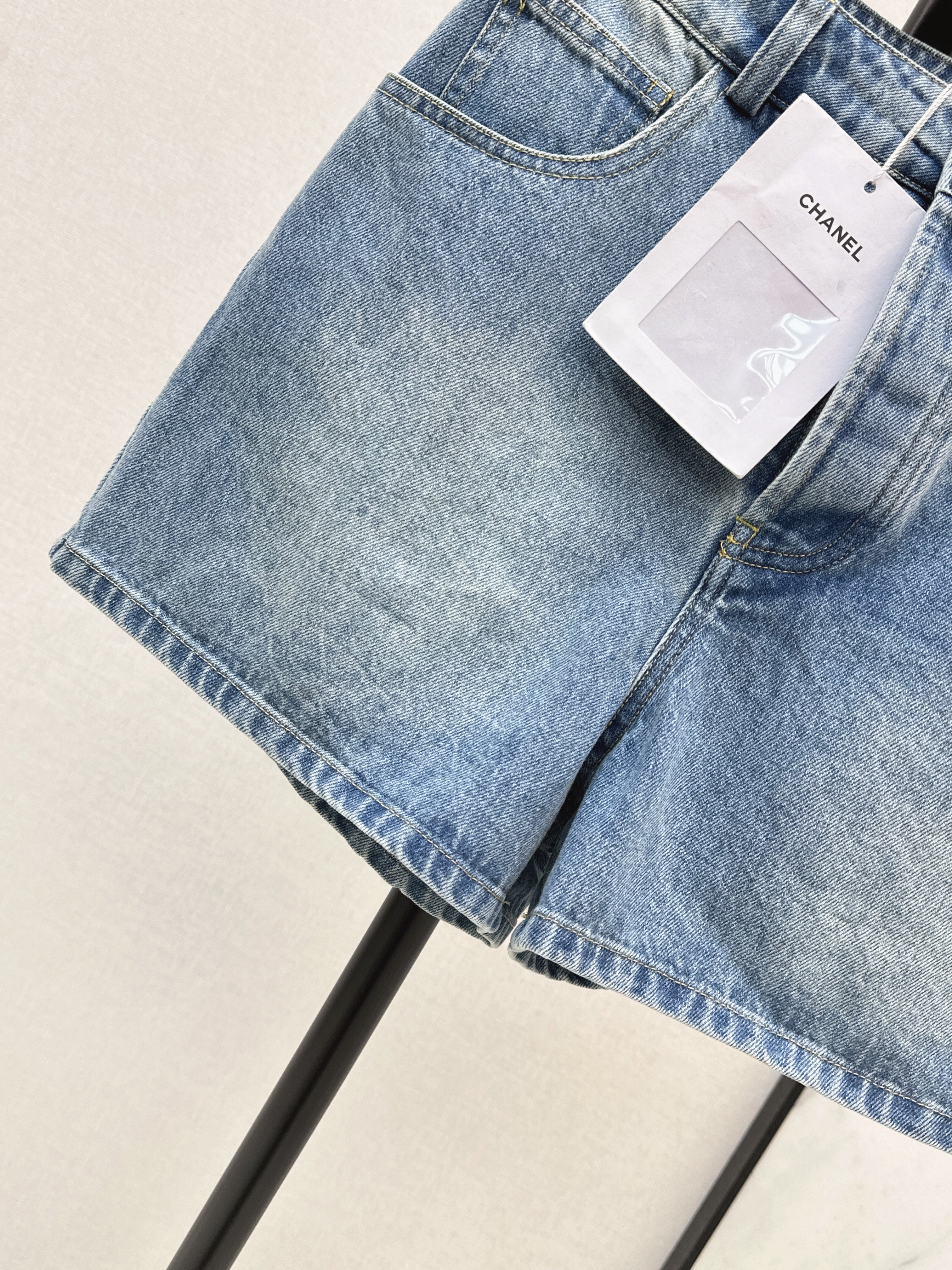 Denim shorts with back waist decoration