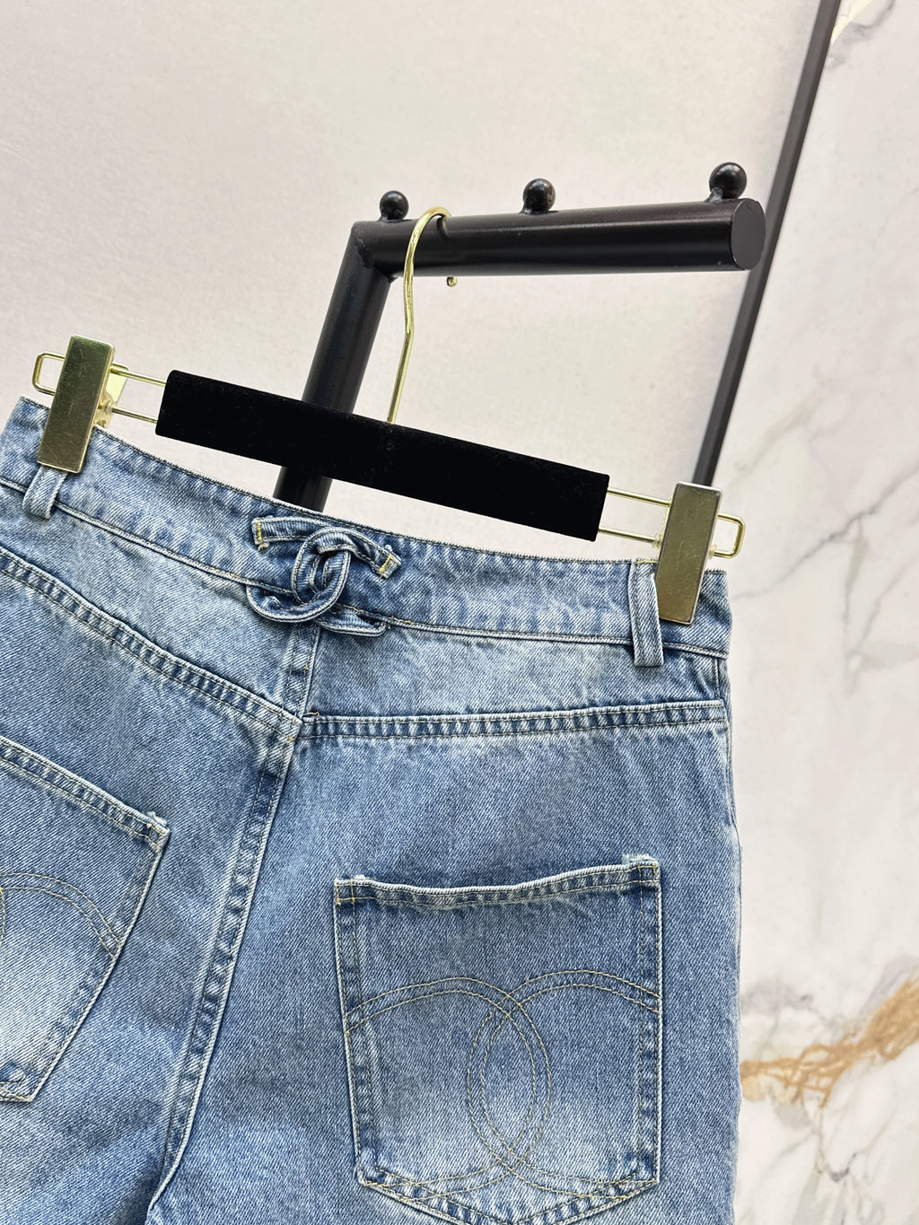 Denim shorts with back waist decoration
