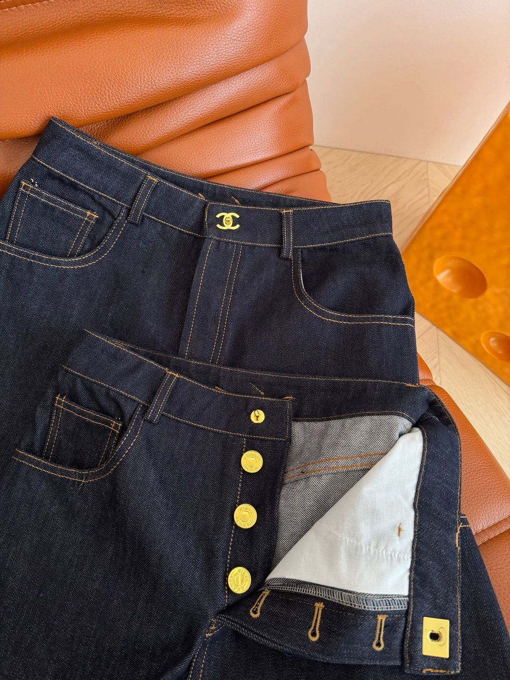 Jeans with a Twist-Lock Metal Buckle Design