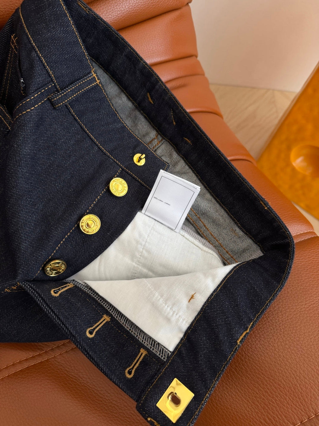 Jeans with a Twist-Lock Metal Buckle Design