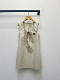 Beige vest dress with contrasting leather label