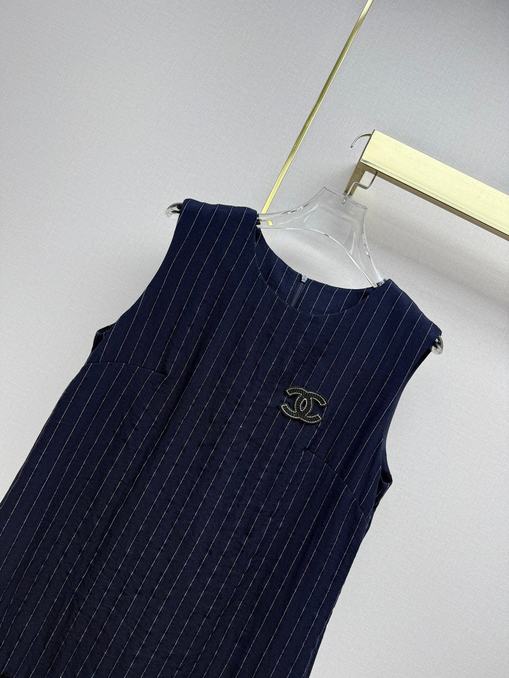 Beige vest dress with contrasting leather label