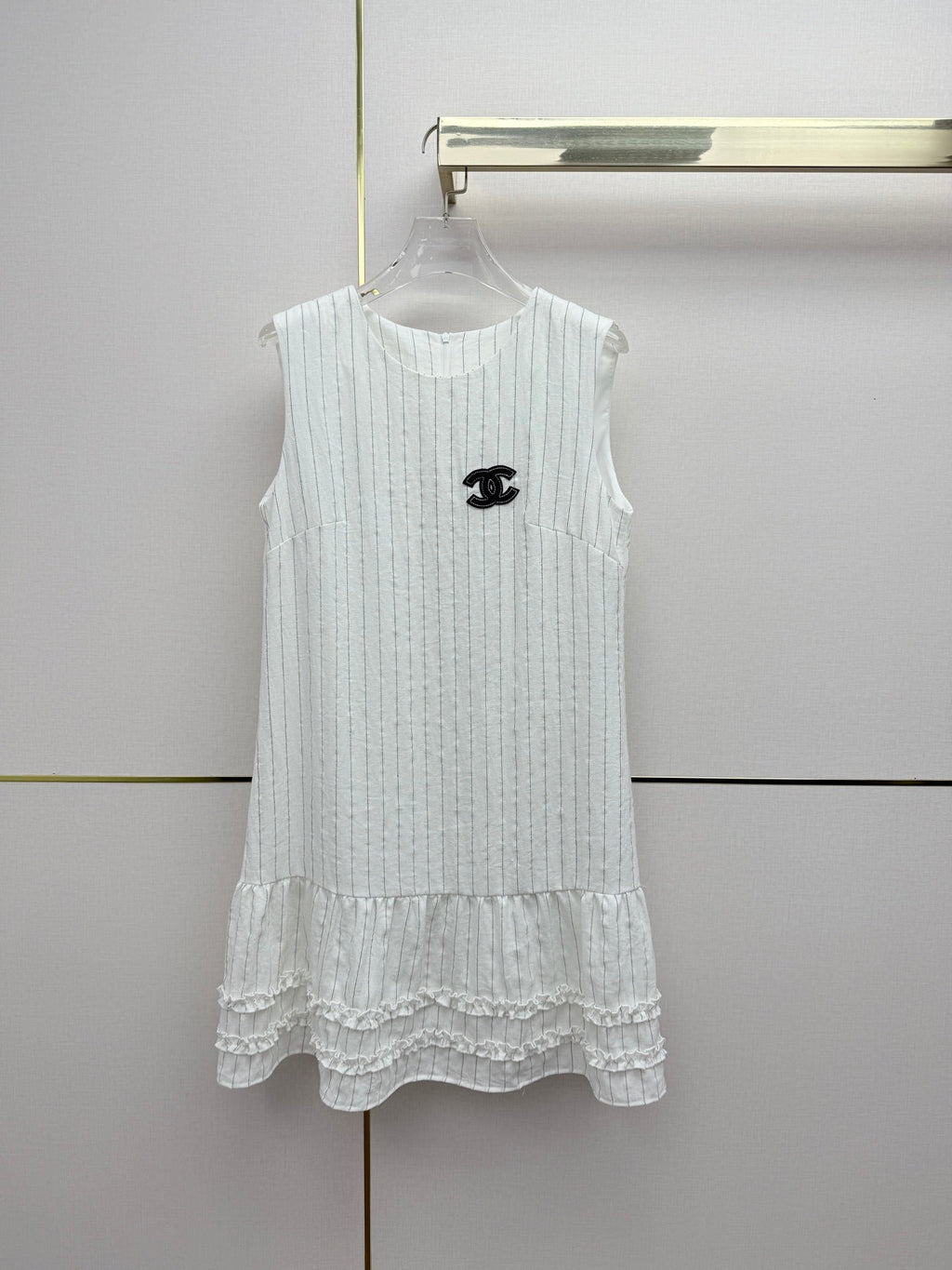 Beige vest dress with contrasting leather label