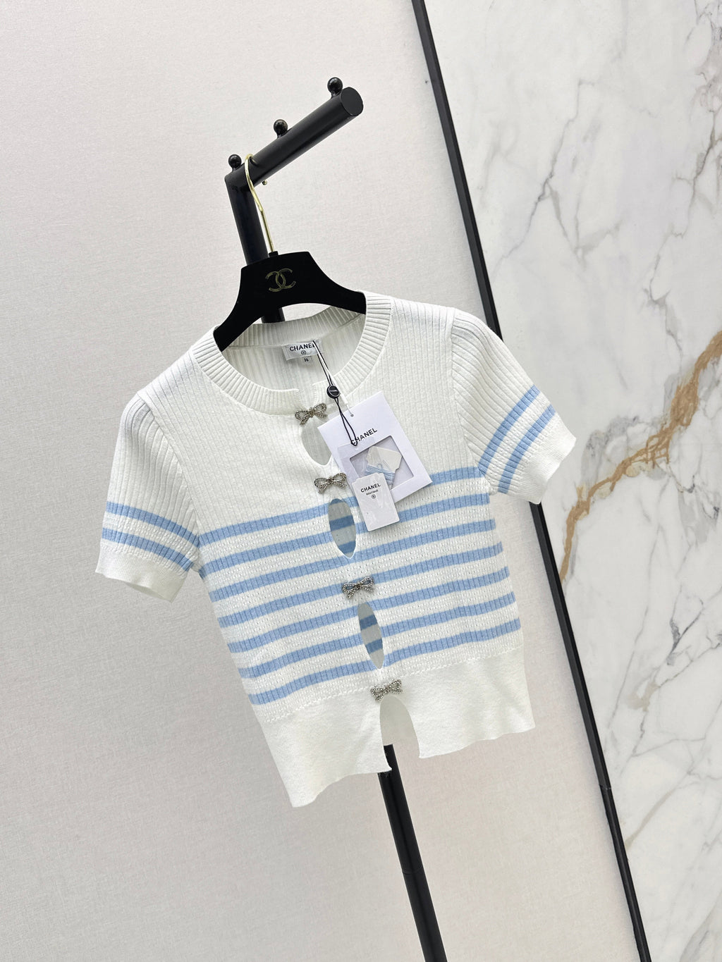 Striped knit top with bow embellishment