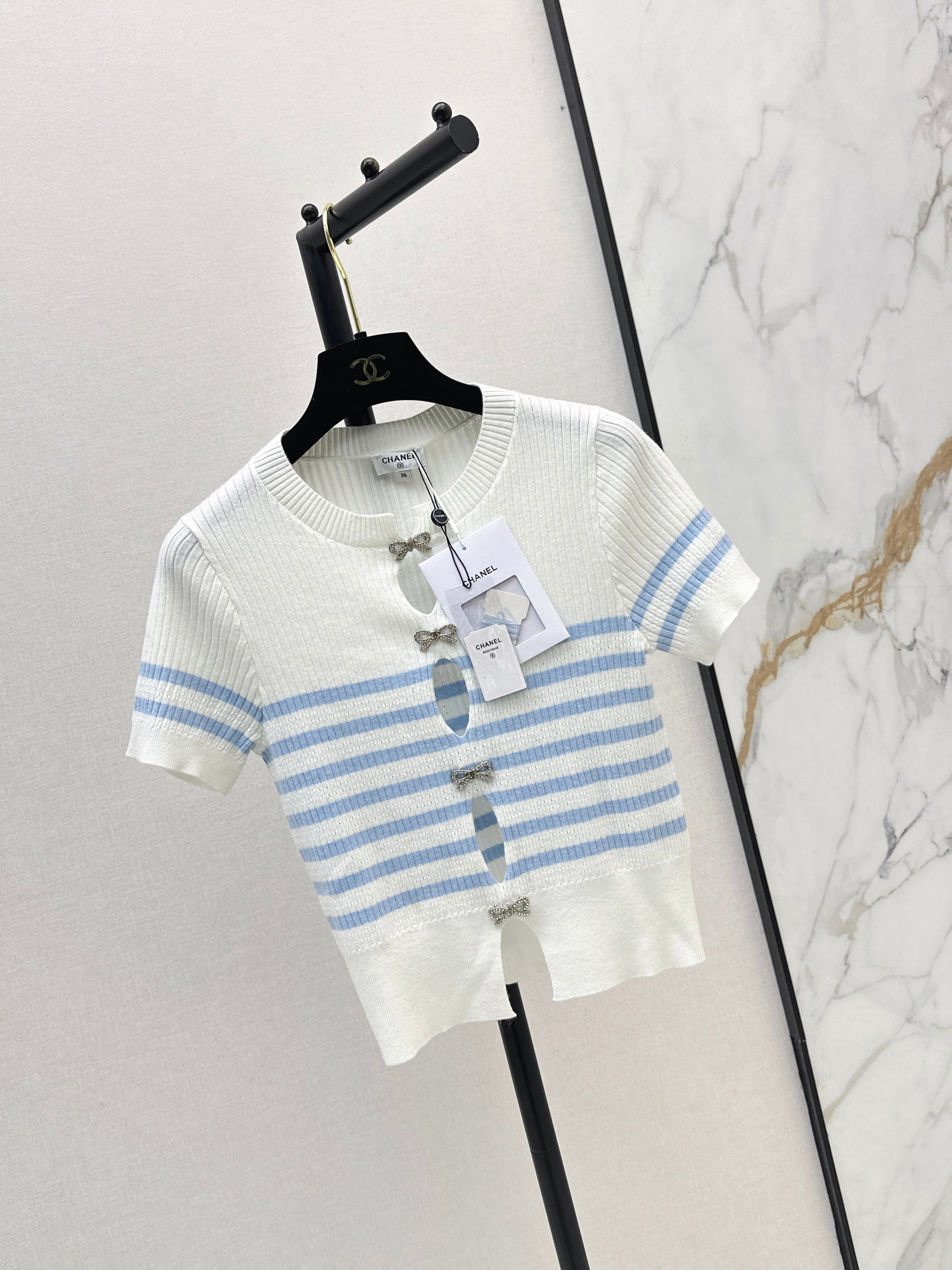 Striped knit top with bow embellishment