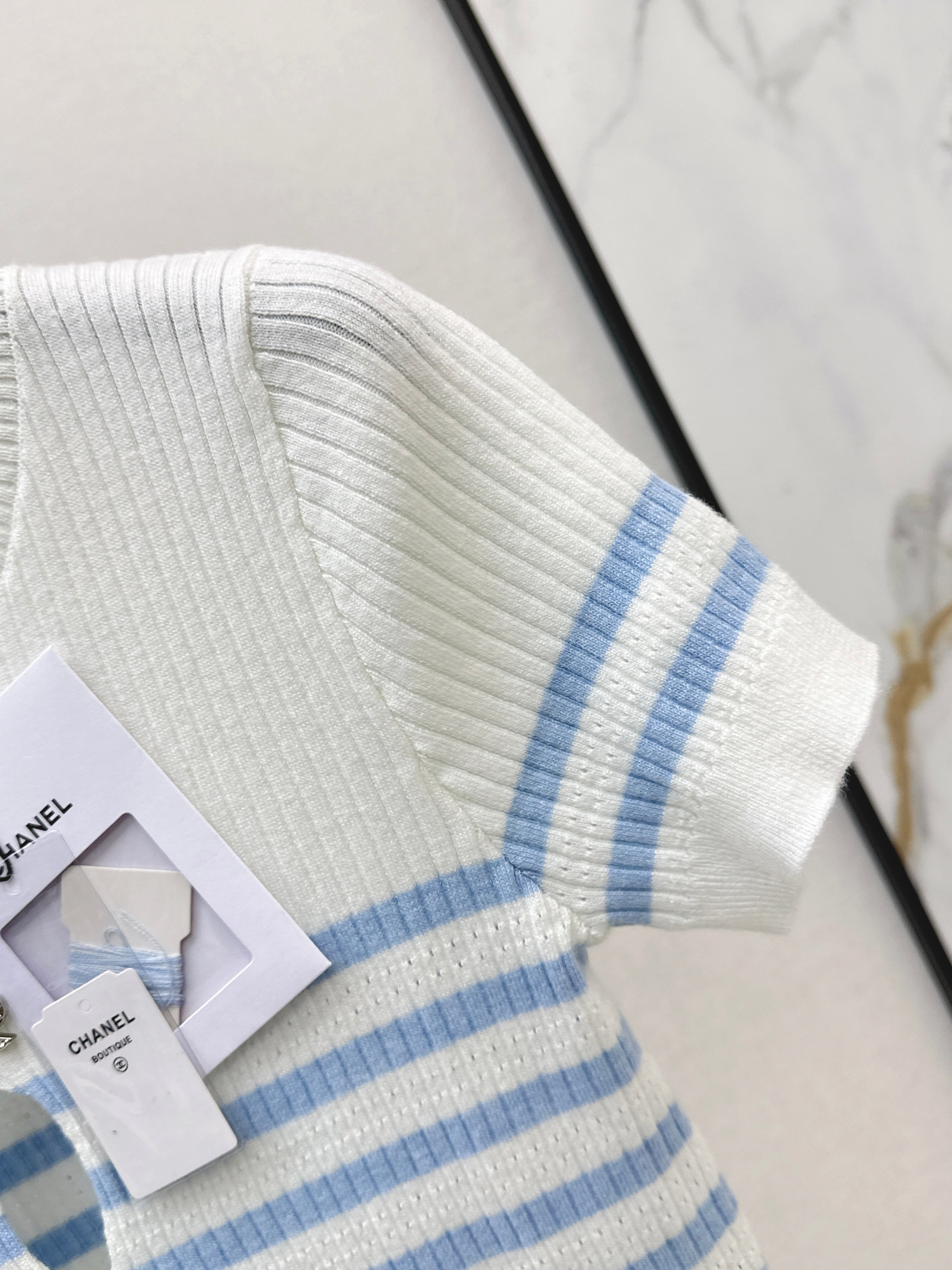 Striped knit top with bow embellishment