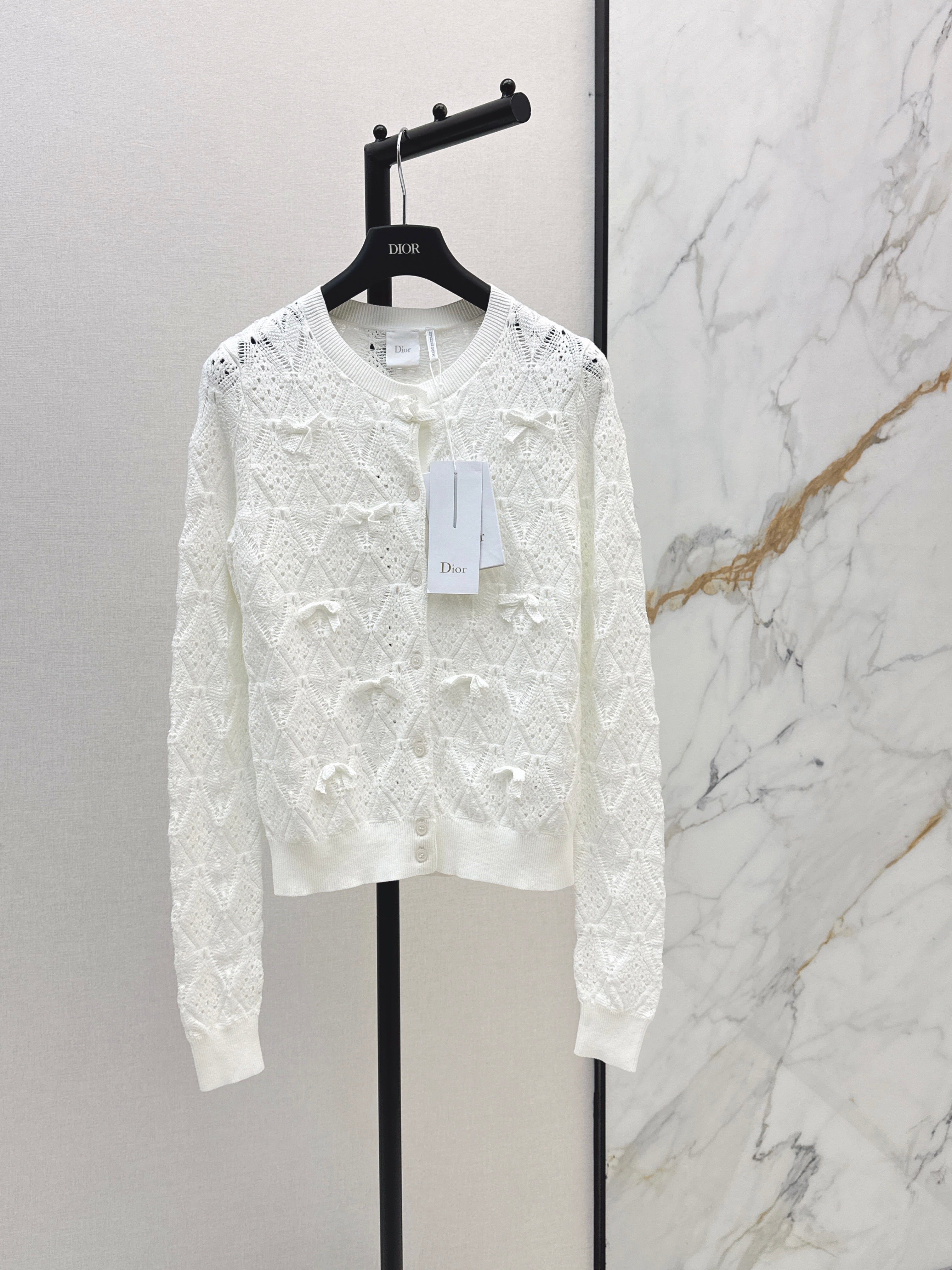 Bow-tie quilted jacquard openwork sweater