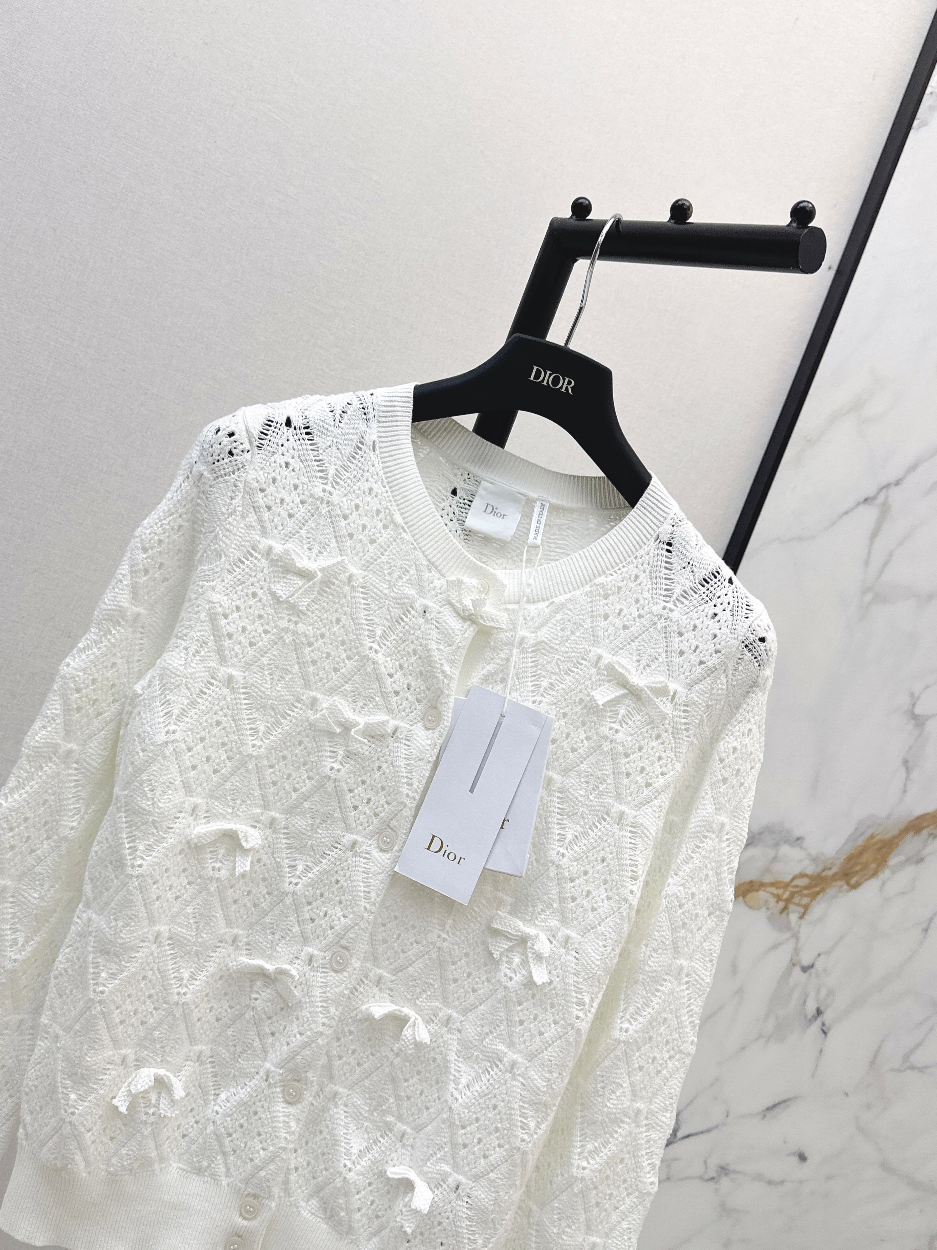 Bow-tie quilted jacquard openwork sweater