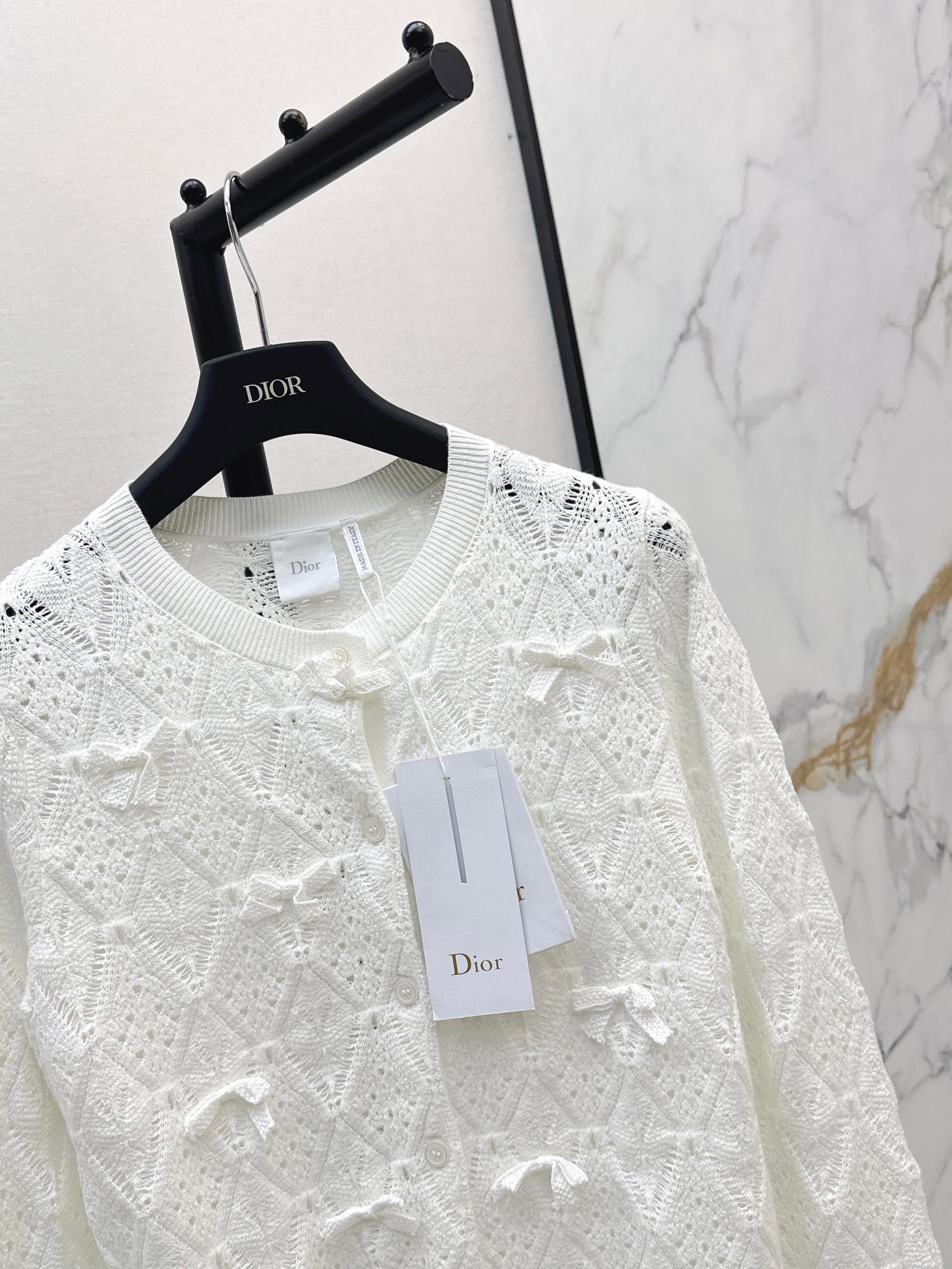 Bow-tie quilted jacquard openwork sweater