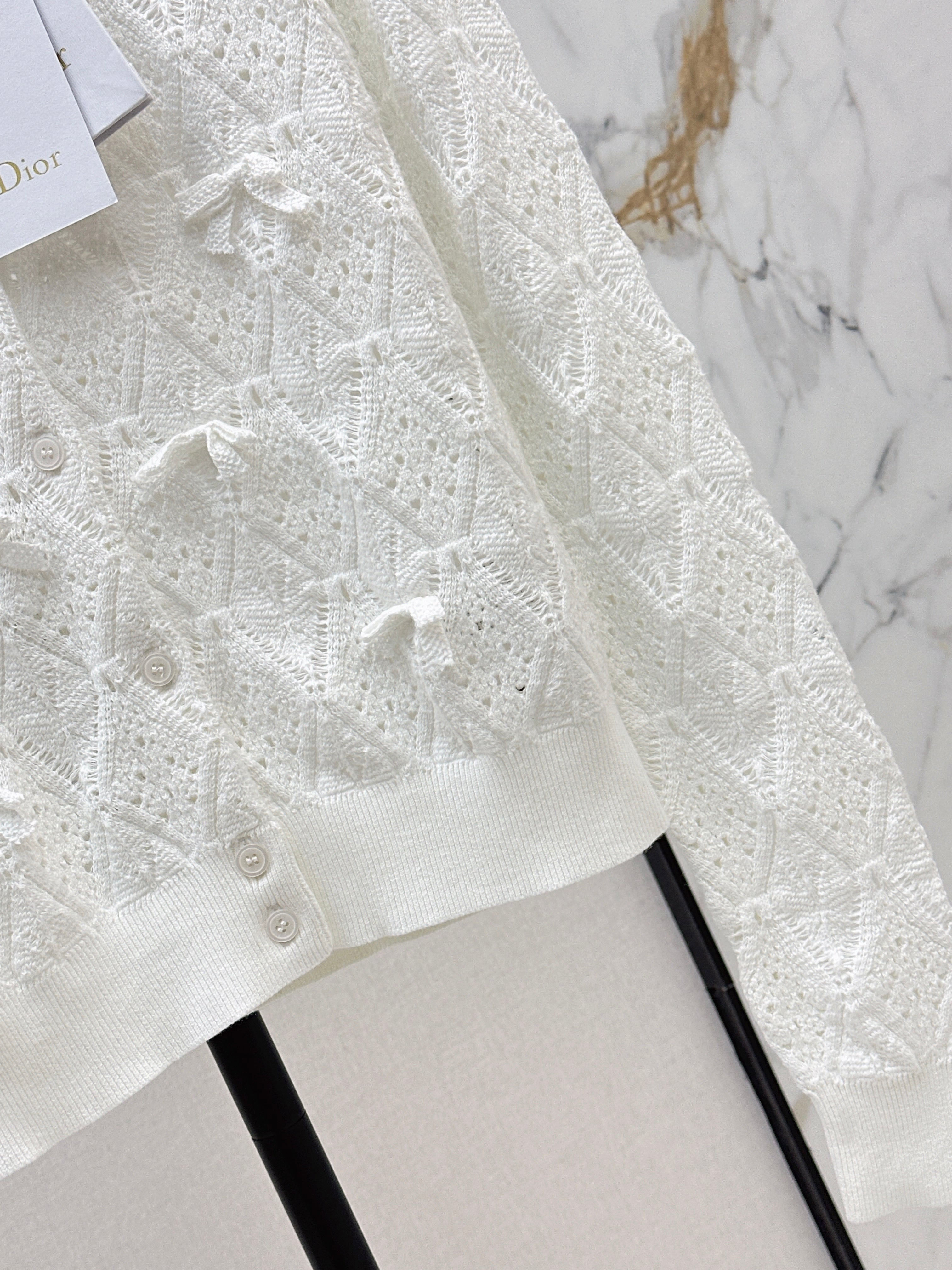 Bow-tie quilted jacquard openwork sweater