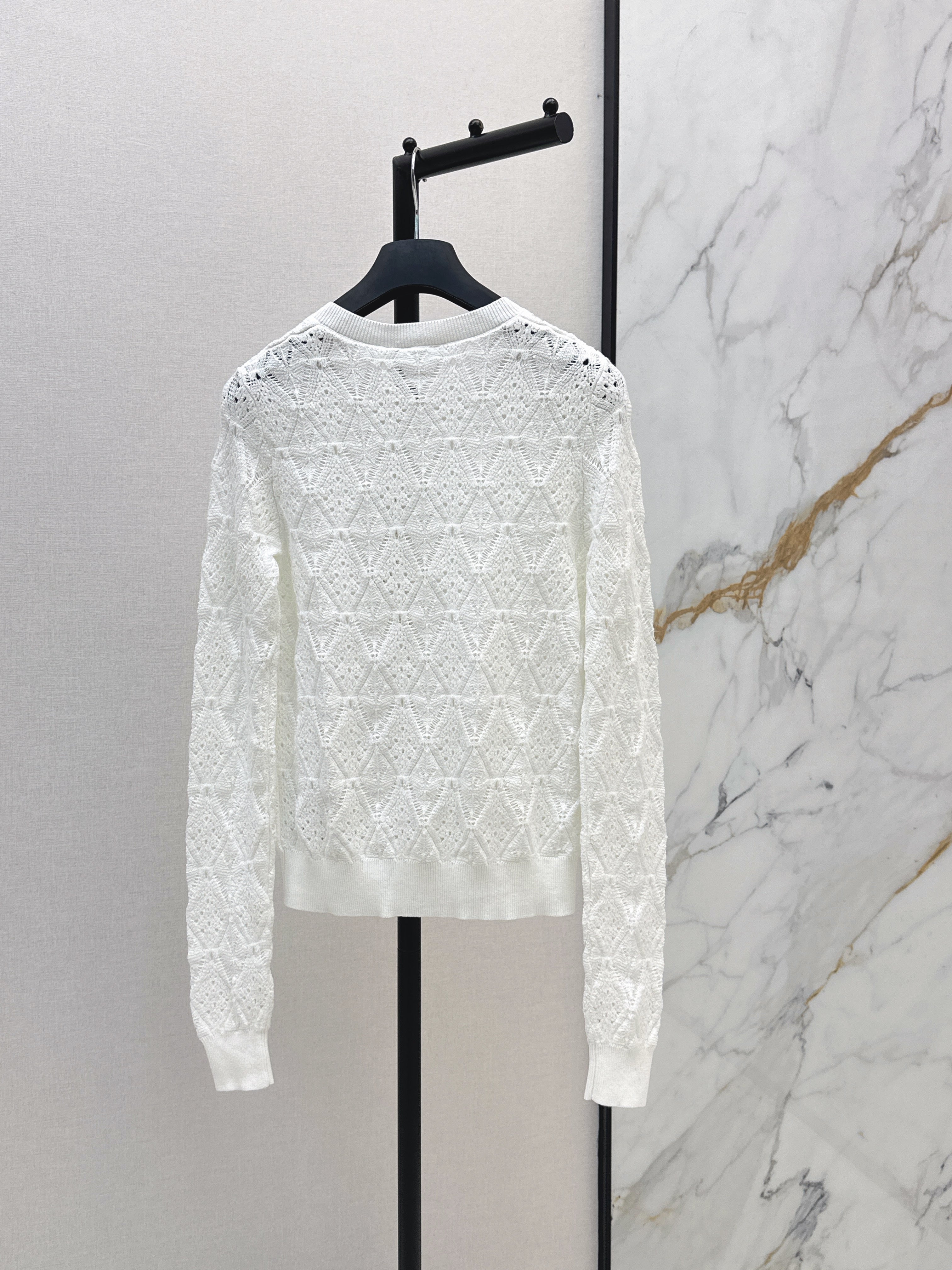 Bow-tie quilted jacquard openwork sweater