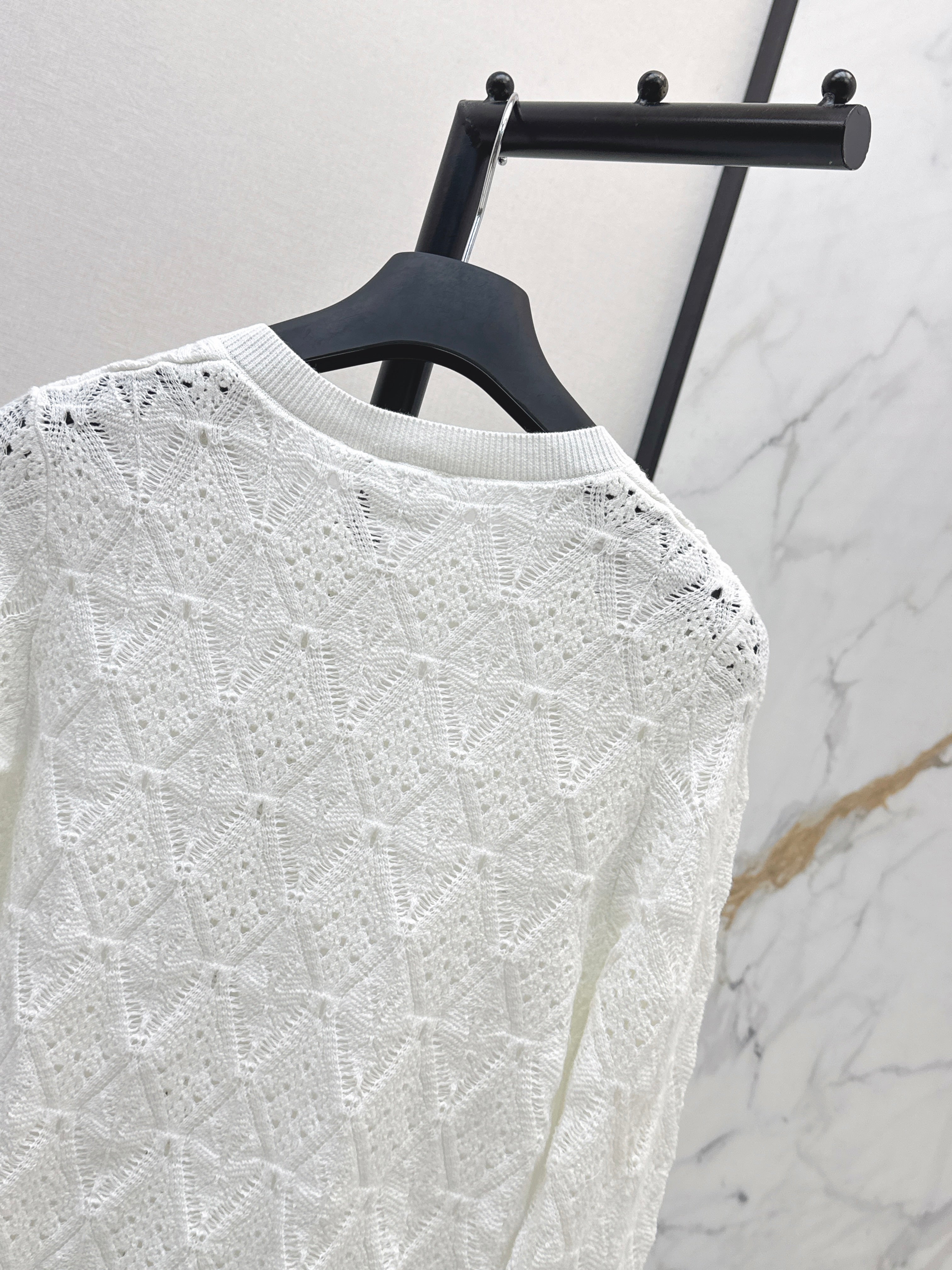 Bow-tie quilted jacquard openwork sweater