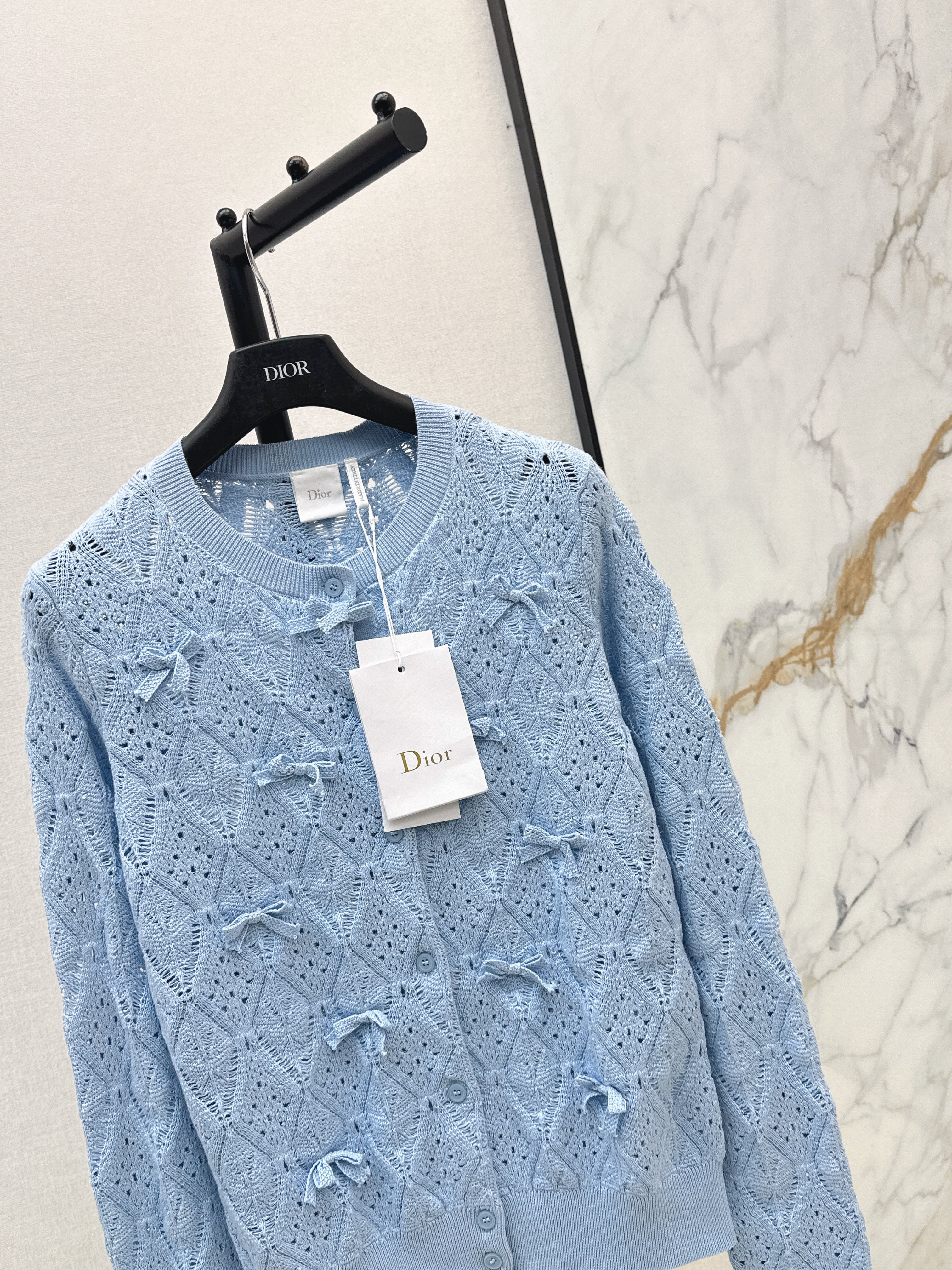 Bow-tie quilted jacquard openwork sweater