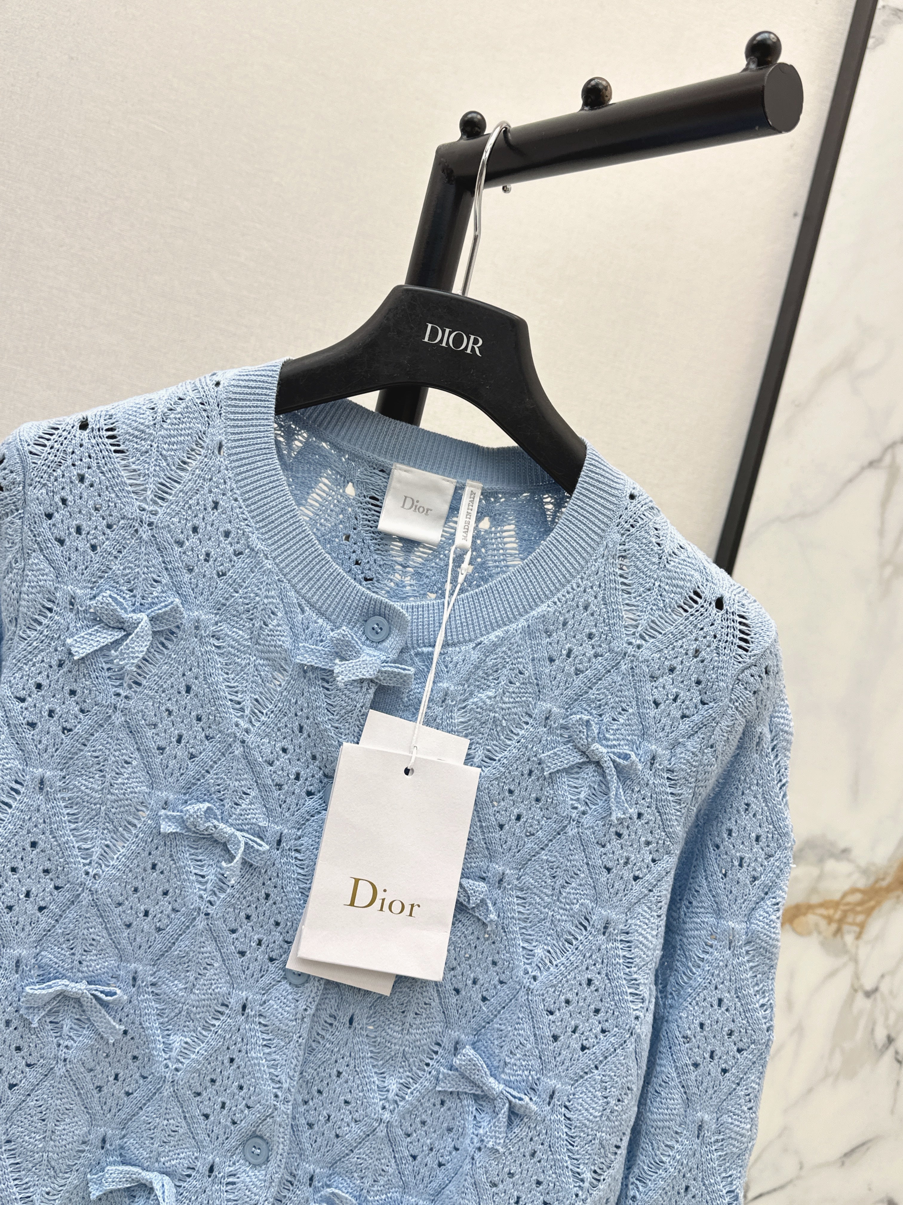 Bow-tie quilted jacquard openwork sweater