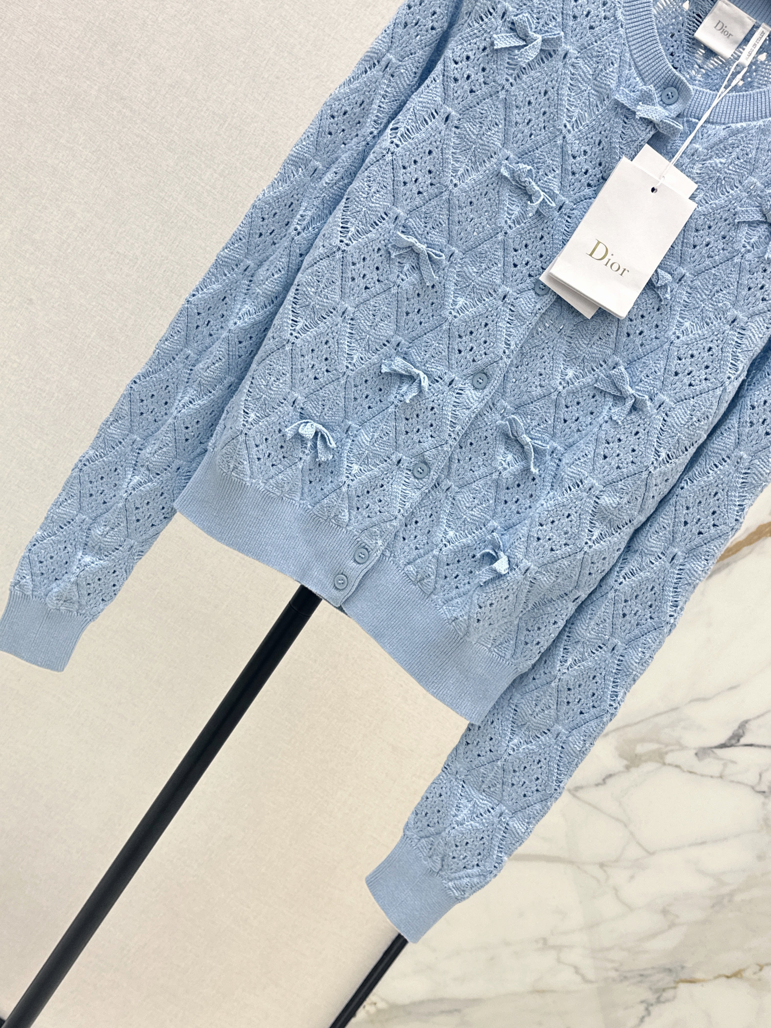 Bow-tie quilted jacquard openwork sweater