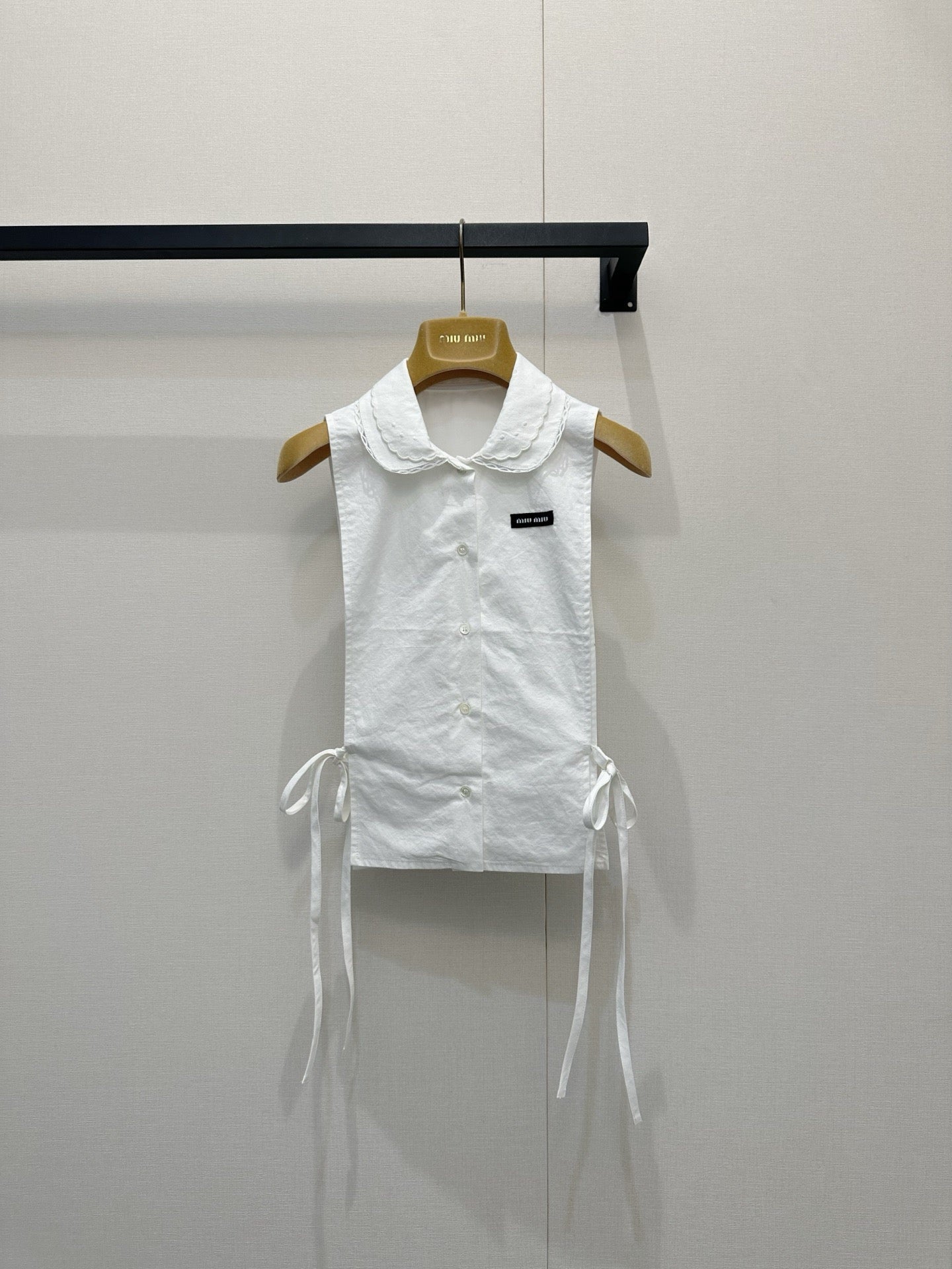 Embroidered sleeveless tie-front vest