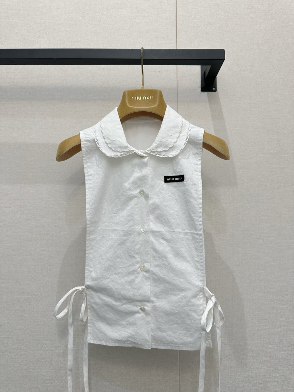 Embroidered sleeveless tie-front vest