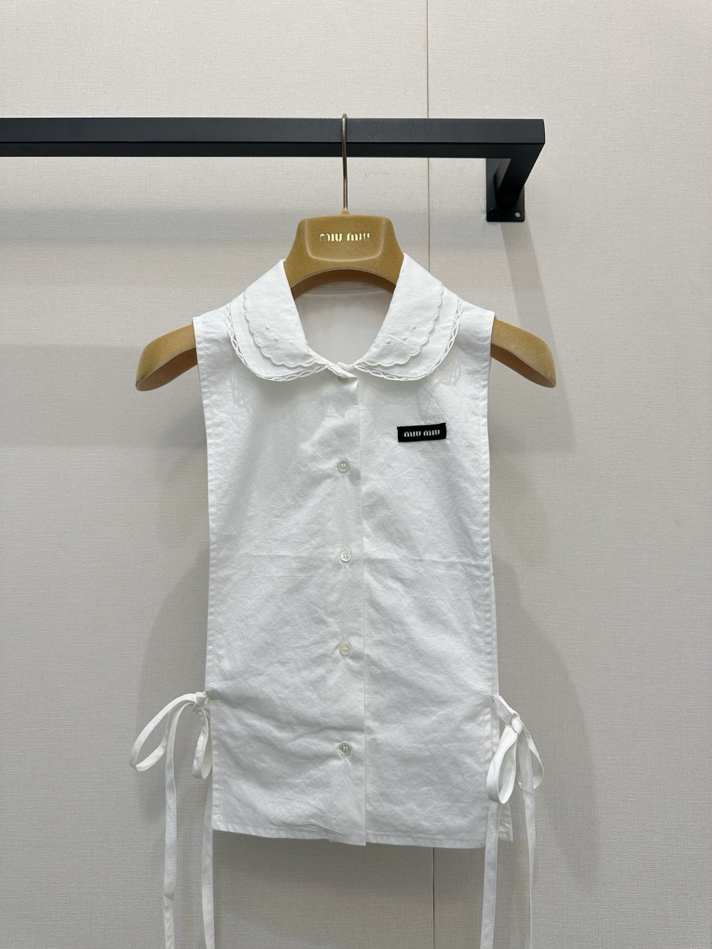 Embroidered sleeveless tie-front vest