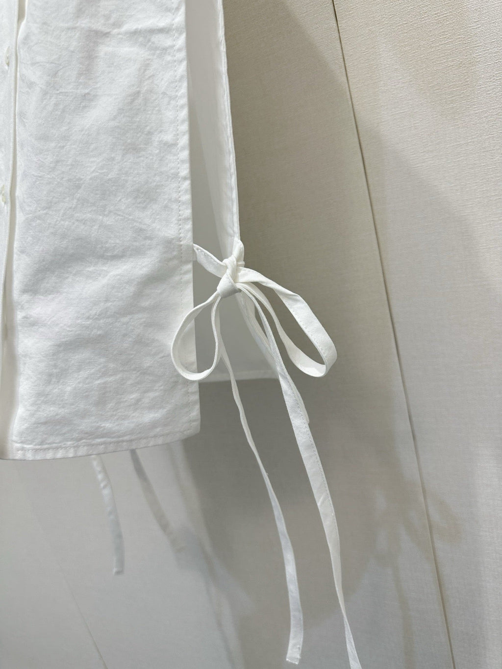 Embroidered sleeveless tie-front vest