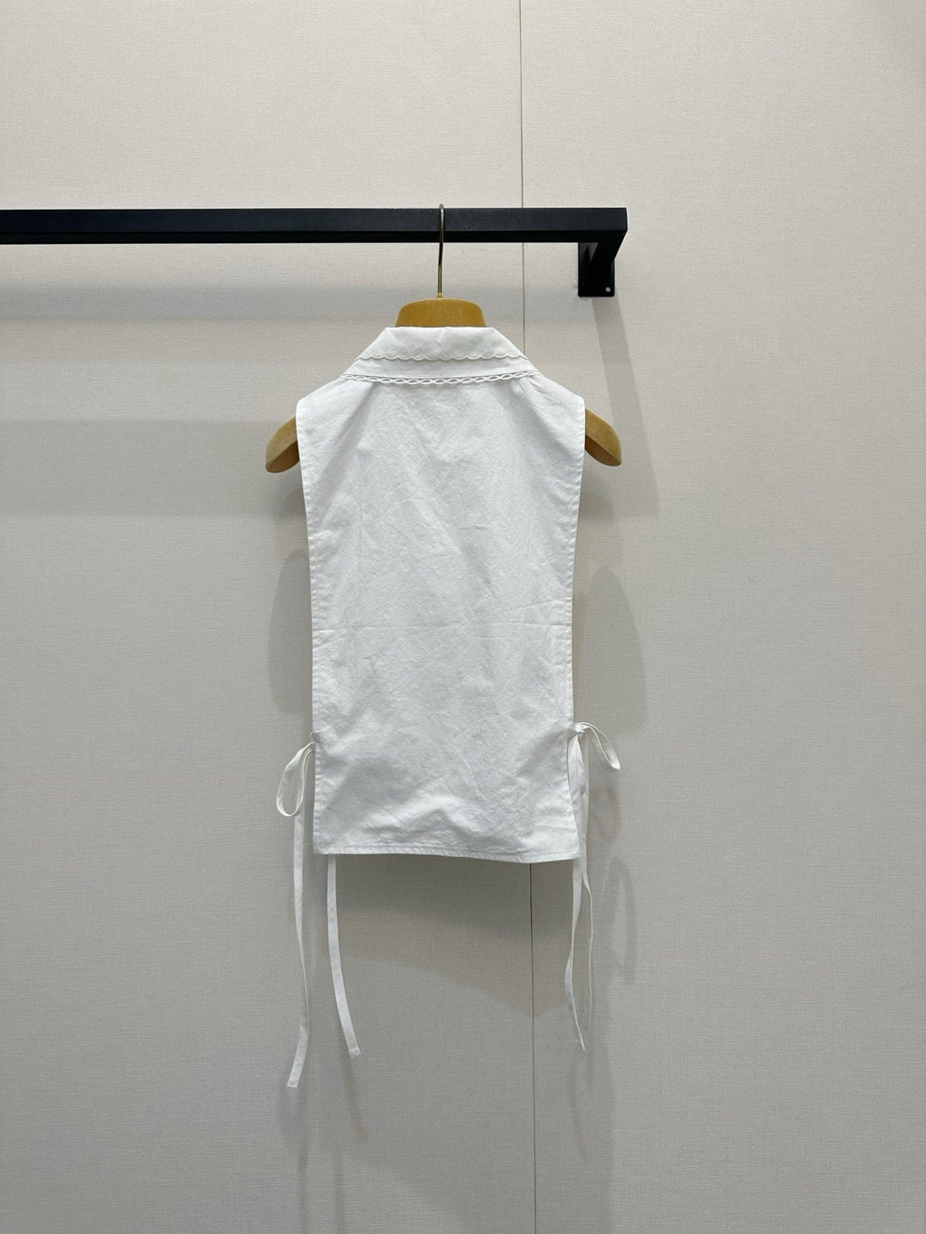 Embroidered sleeveless tie-front vest