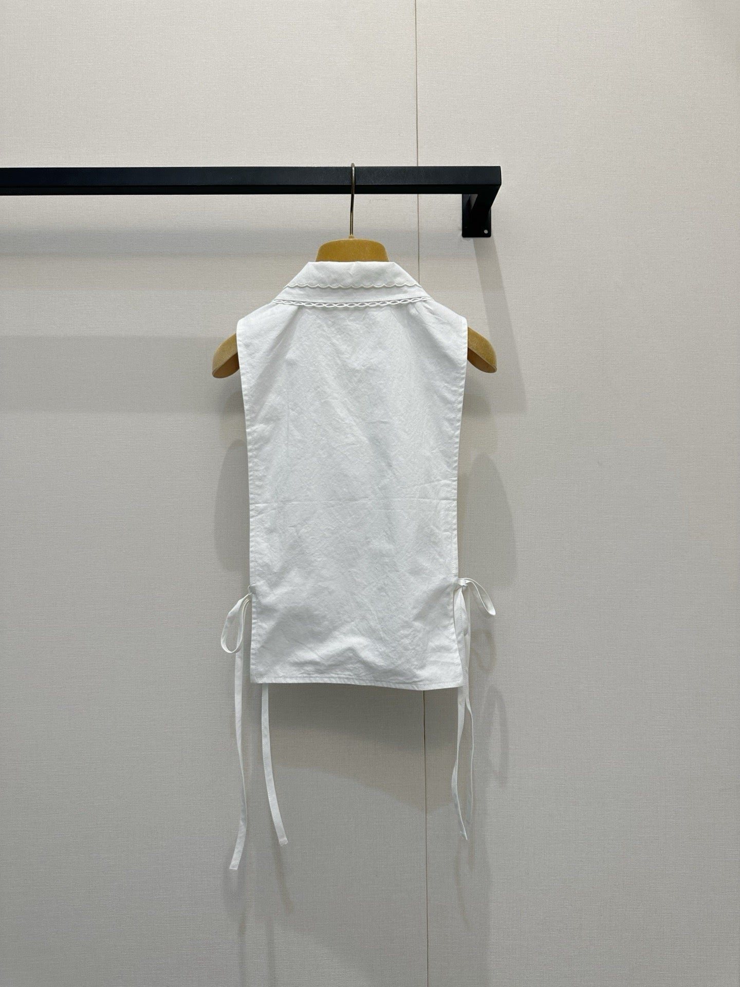Embroidered sleeveless tie-front vest