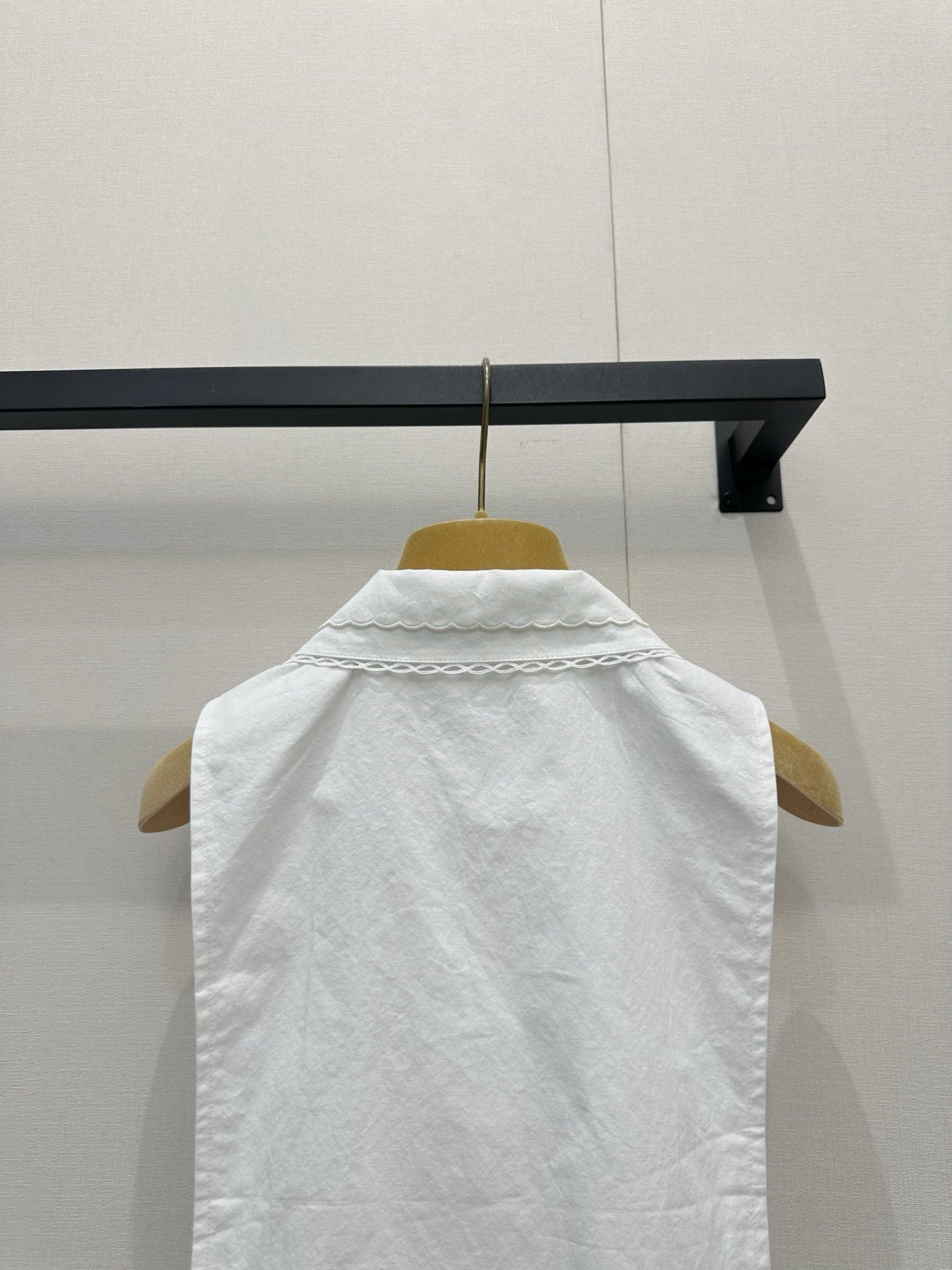 Embroidered sleeveless tie-front vest
