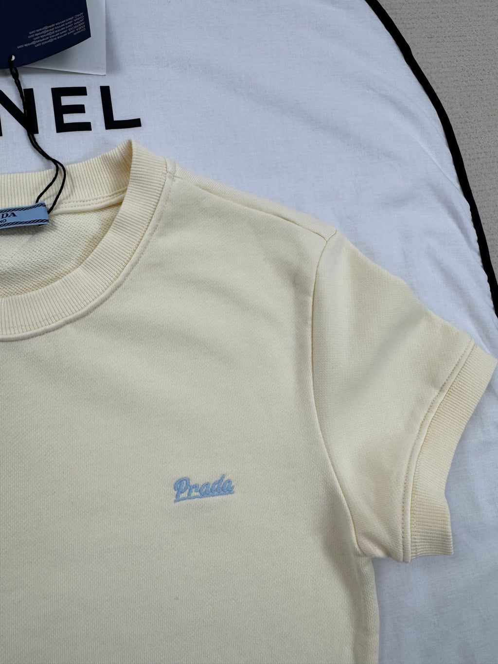 Pale yellow ribbed crew neck short-sleeved shirt